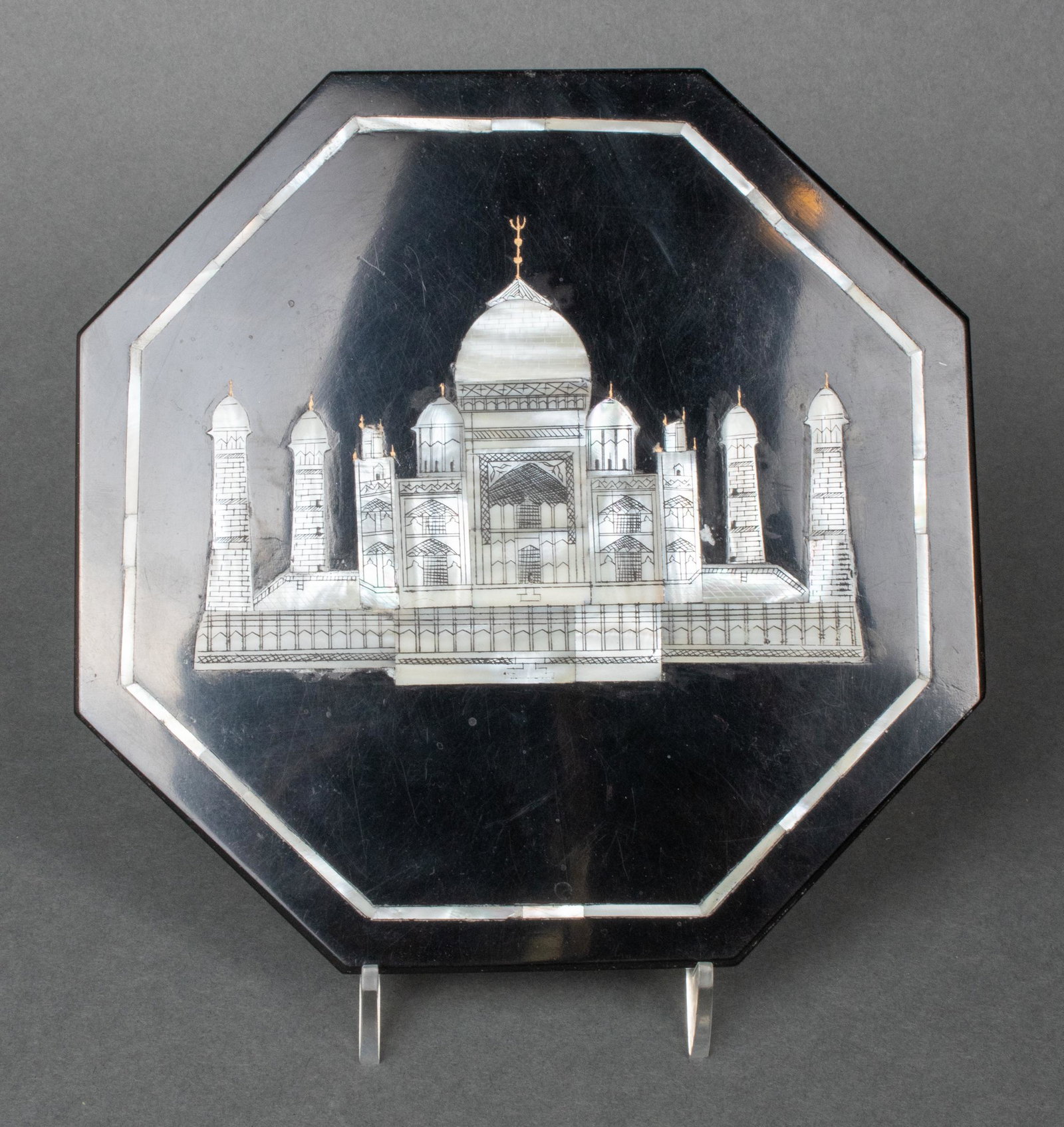 Indian Mother-of-Pearl Inlaid Taj Mahal Plaque: Indian octagonal tile depicting a mother-of-pearl inlaid Taj Mahal in fitted case. 7.25" H x 7.25" W x .25" D. Minor scratch to surface.