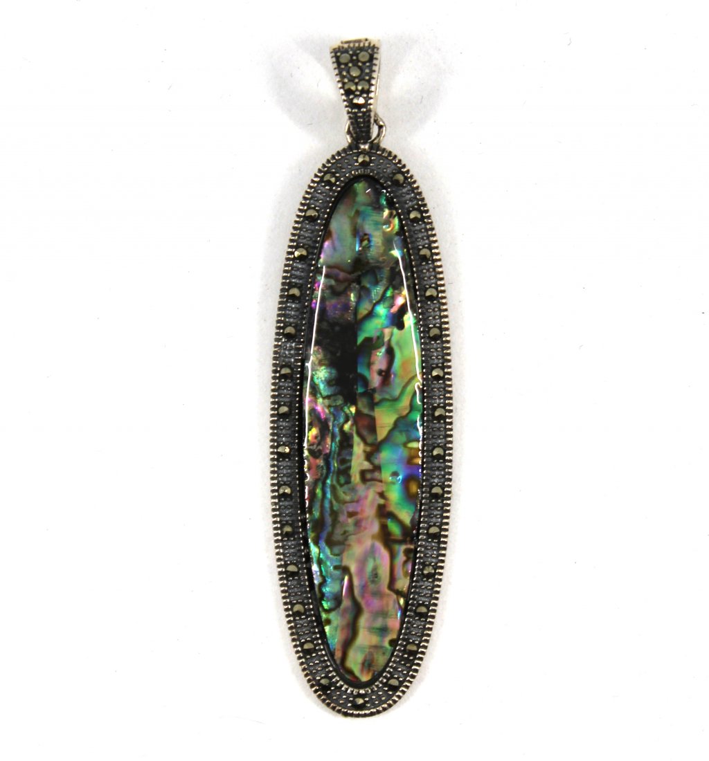 Silver, Mother-of-Pearl, and Marcasite Pendant: Oblong pendant in sterling silver with mother of pearl center and marcasite. Marked "AF.925." Measures 3.0" L x 0.812" W. Approx: 0.30 ozt.