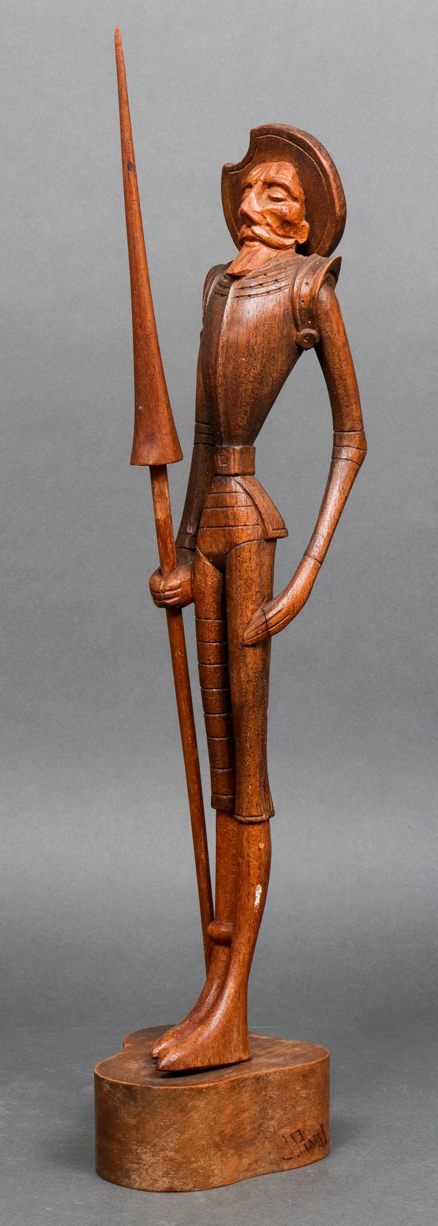 Jose Pinal "Don Quixote" Carved Wood Sculpture: Jose Pinal (Mexican, 1913-1983) "Don Quixote," carved wood figural sculpture depicting the Cervantes character with spear, signed on base: "J. Pinal." 19.25" H x 4.25" W x 4.5" D.