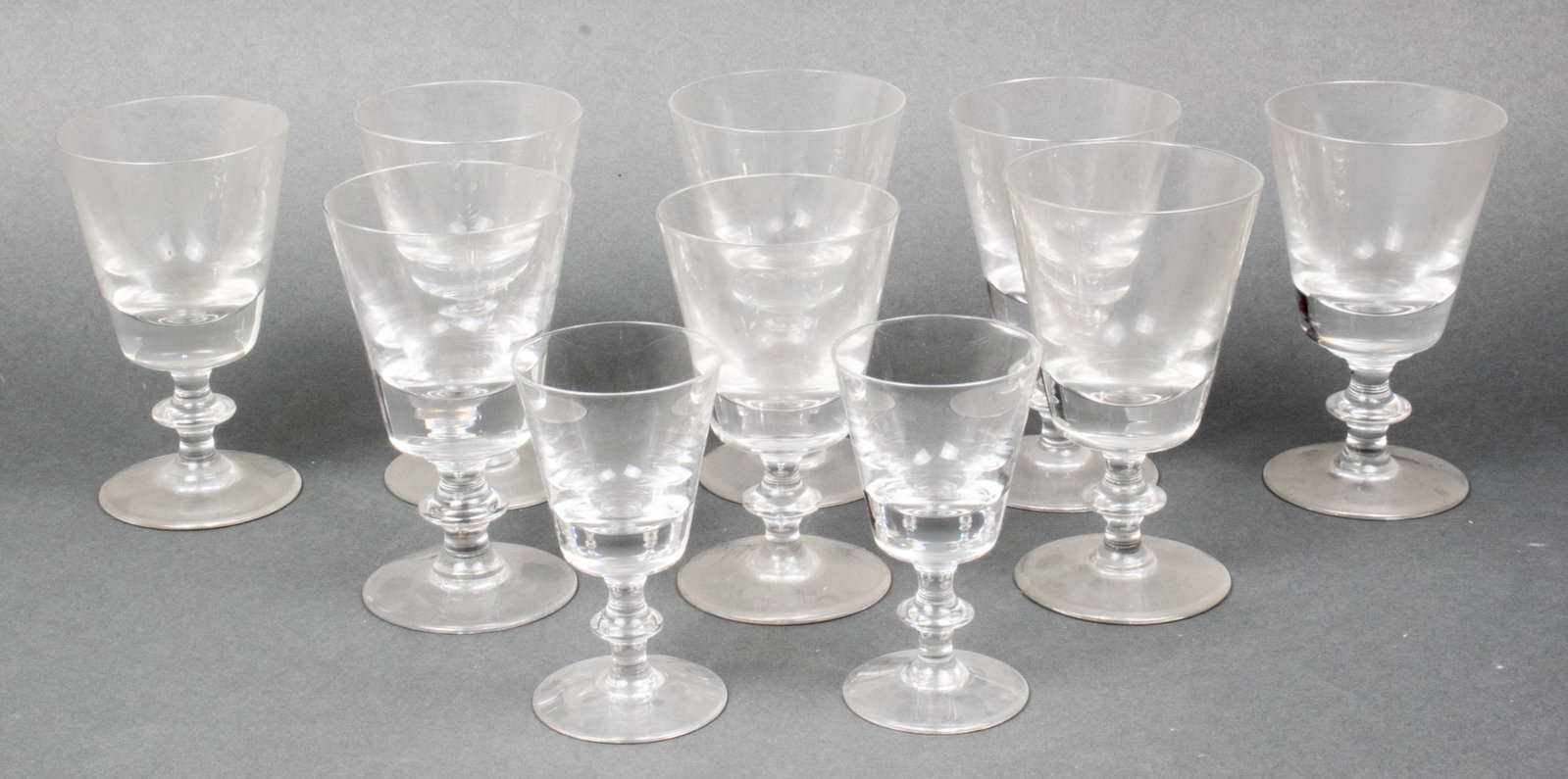 Val St. Lambert "State Plain" Crystal Stemware, 10: Set of ten Val St. Lambert colorless crystal stemware, in the "State Plain" pattern, comprising eight white wine goblets and two red wines, acid signed to underside. Tallest: 6" H.