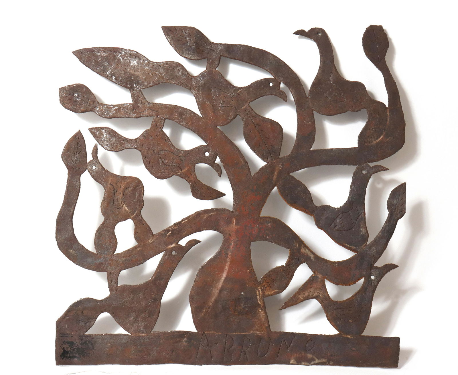 A. Bruno Haitian Steel Drum Pierced Sculpture: A. Bruno Haitian steel drum pierced metal bird motif sculpture, signed at bottom: "A. Bruno." 18.5" H x 18.5" W.