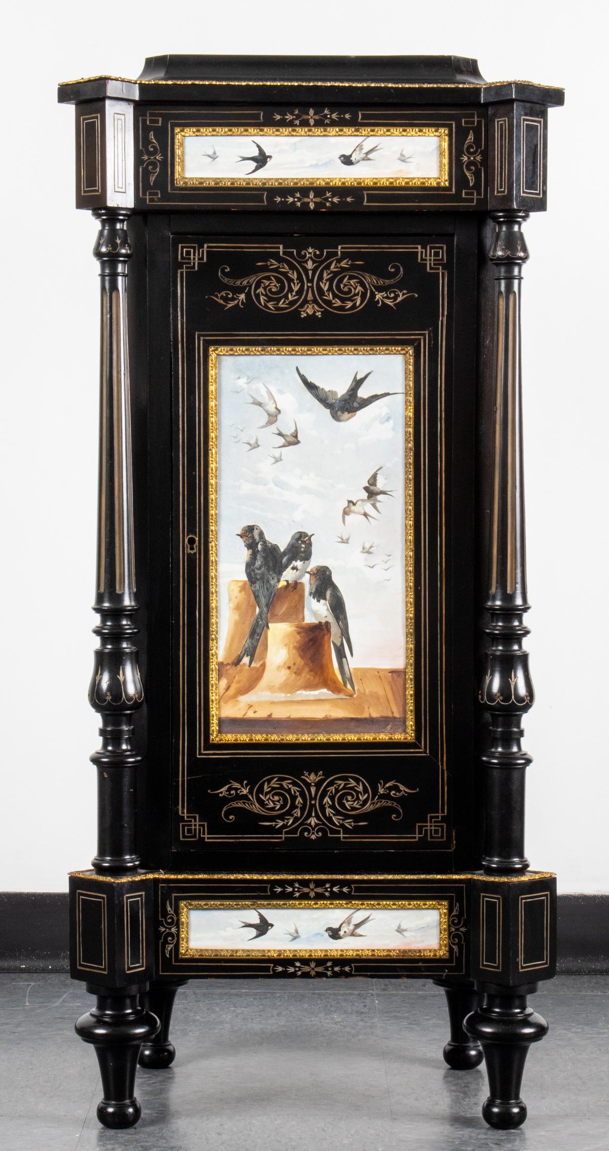 Napoleon III Ebonized Porcelain Inset Cabinet: Napoleon III ormolu mounted ebonized wood parlor cabinet, featuring inset porcelain plaques painted with bird motif, comprising one drawer over cabinet door, having incised line decoration, detached f