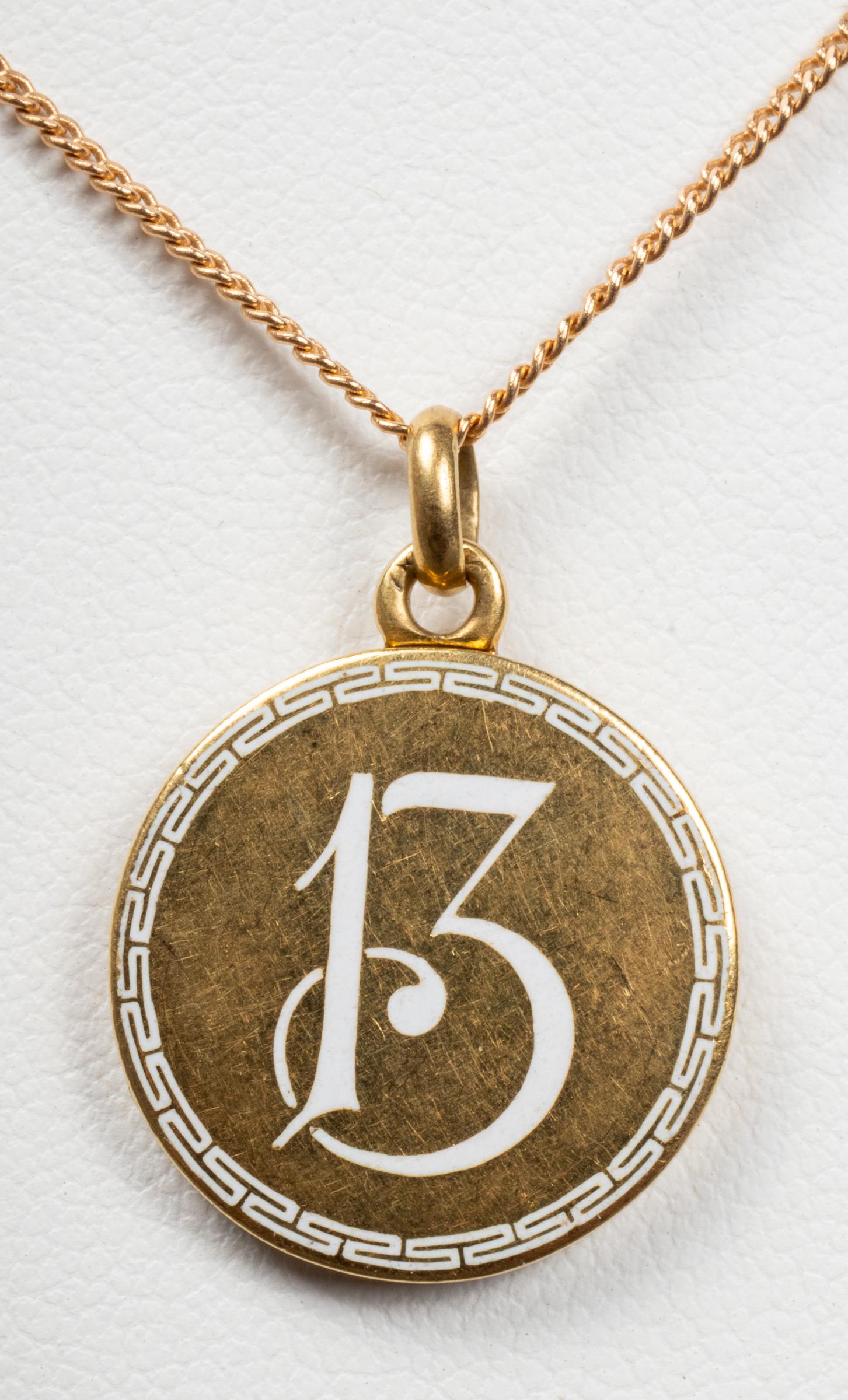 Vintage 18K & 14K #13 Locket Pendant Necklace: Vintage 18K and 14K yellow gold number "13" enamel with Greek key border design round locket pendant necklace, marked: "14K." 18K Locket: 1.0" L x 0.75" W. 14K chain: 18" L x 0.06" W. Approx: 5.3 dwt 