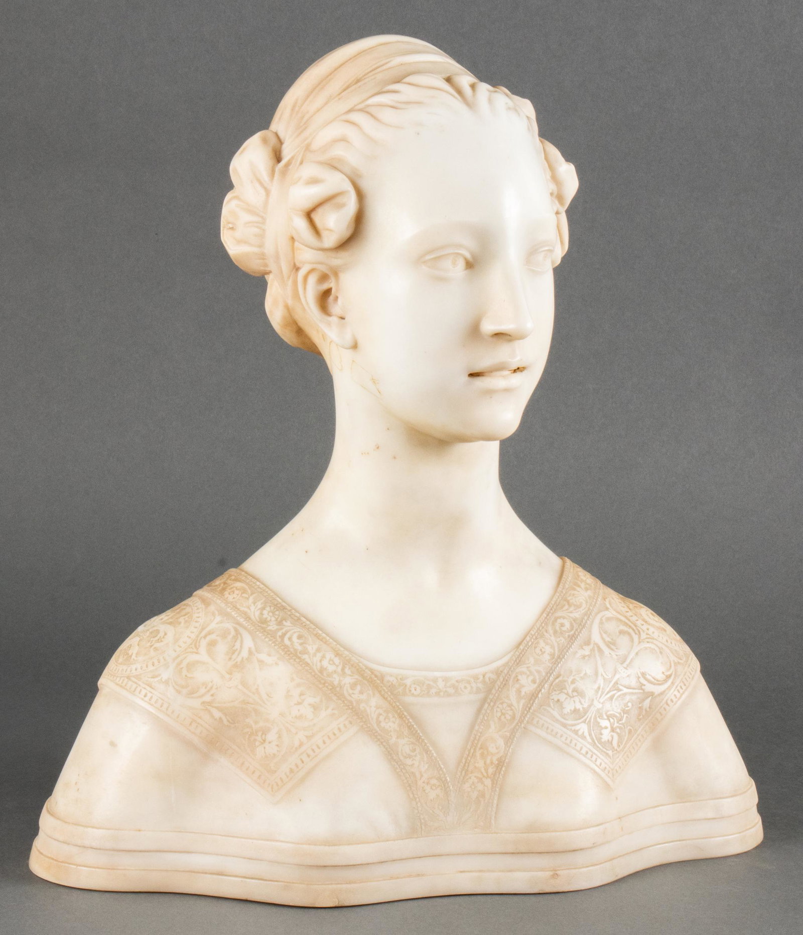 Art Nouveau Continental Alabaster Bust of a Woman: Continental Art Nouveau carved alabaster sculpture depicting bust of a woman in the Renaissance style. 20" H x 17" W x 7" D.