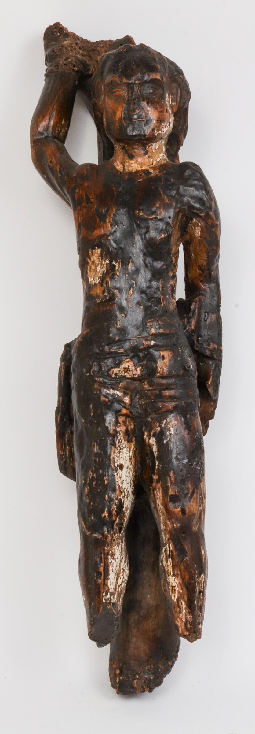 Carved Wood "Bound Slave" Figural Sculpture: Tribal or Folk Art carved wood sculpture with waxed finish depicting a bound slave or prisoner tied to pole. 21.75" H x 5" W x 4.5" D. Wormage, minor losses and surface wear.