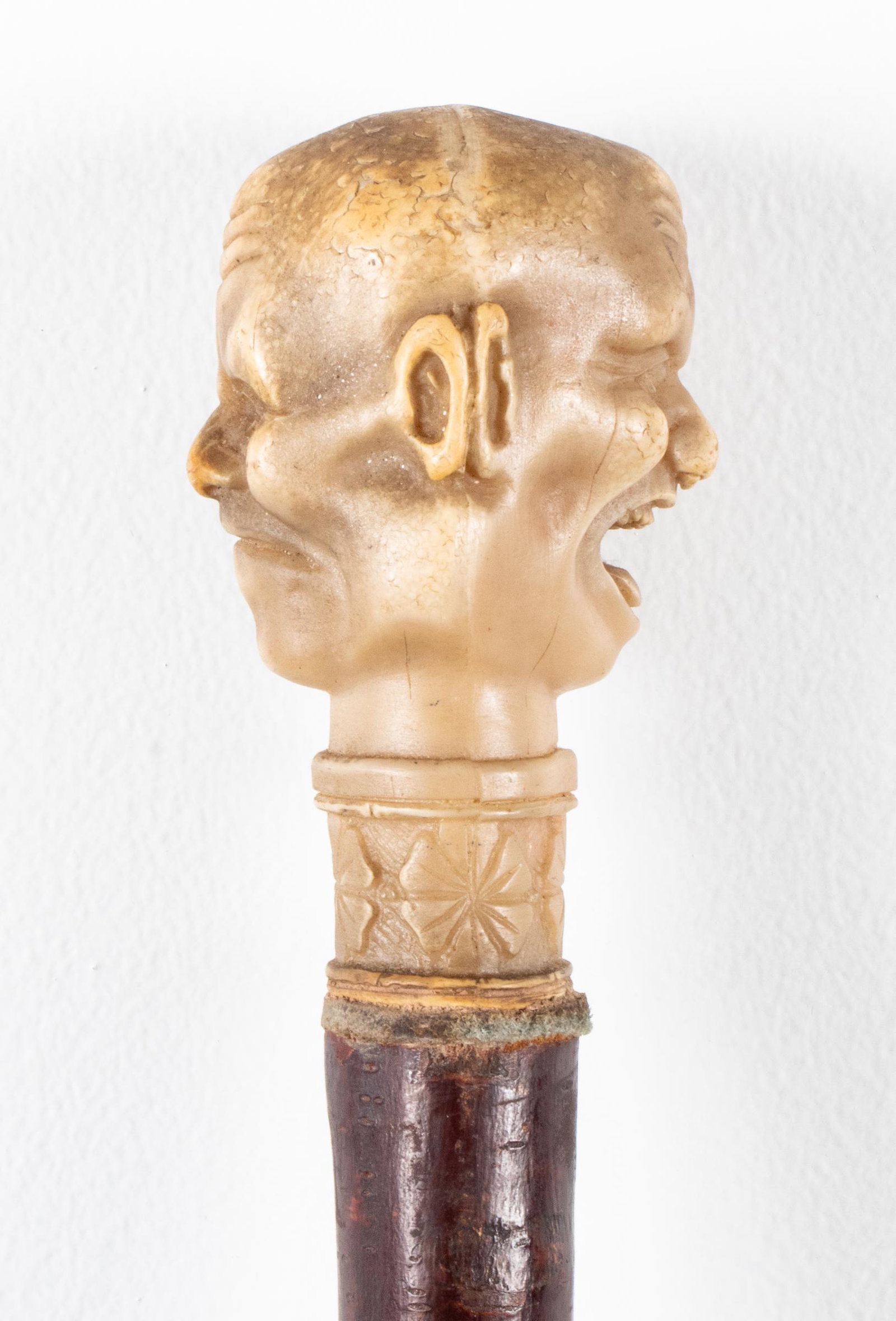 Dual Japanese Noh Mask Handle Walking Cane: Walking stick / cane with resin handle in the form of two Japanese Noh masks, the end with metal ferrule. 32.5" L.