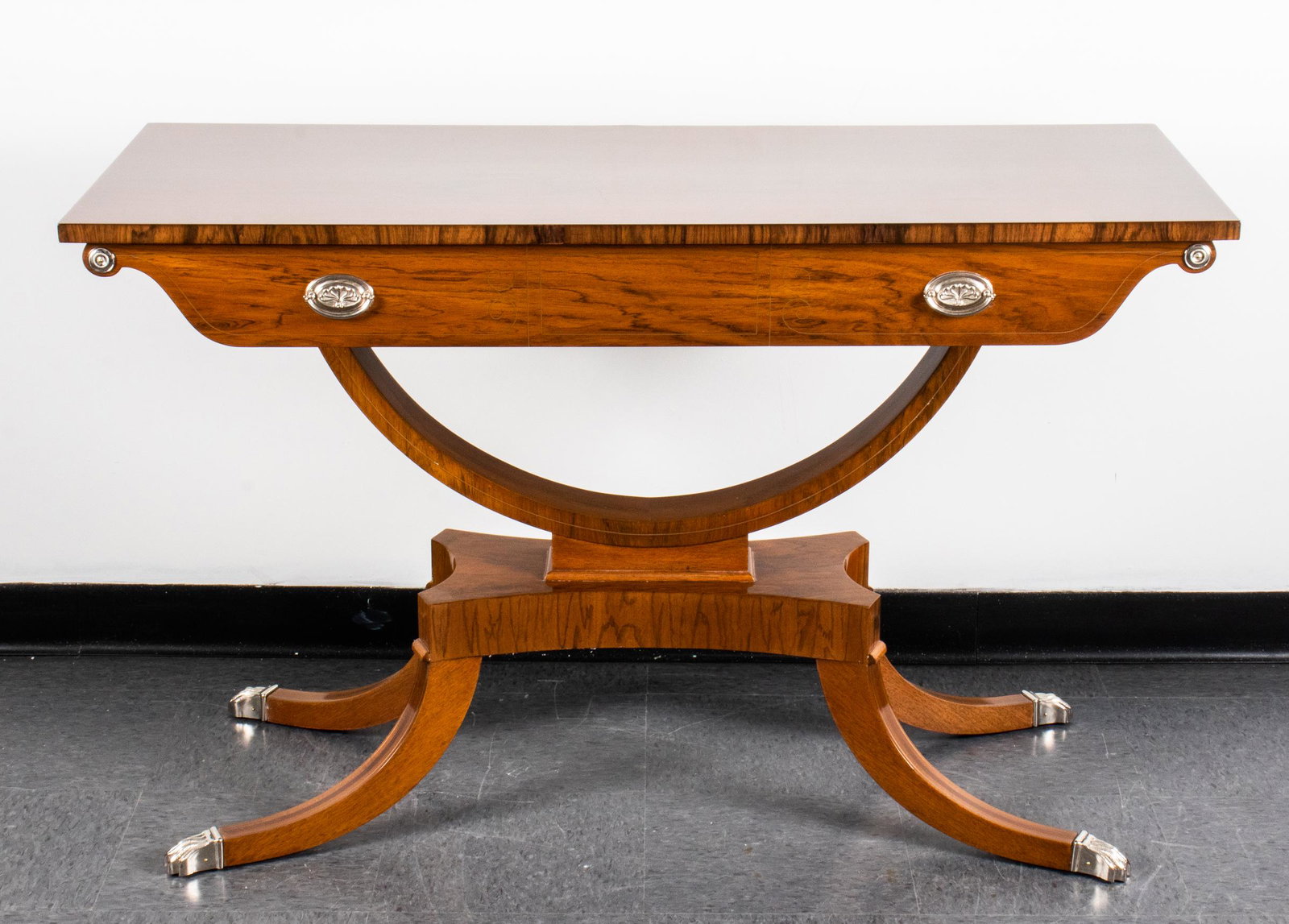 Federal Revival Claw-Footed Console Table: Federal Revival console table with single drawer over pedestal base with four legs terminating in silver-tone metal claw feet. 30.5" H x 48" W x 20" D.