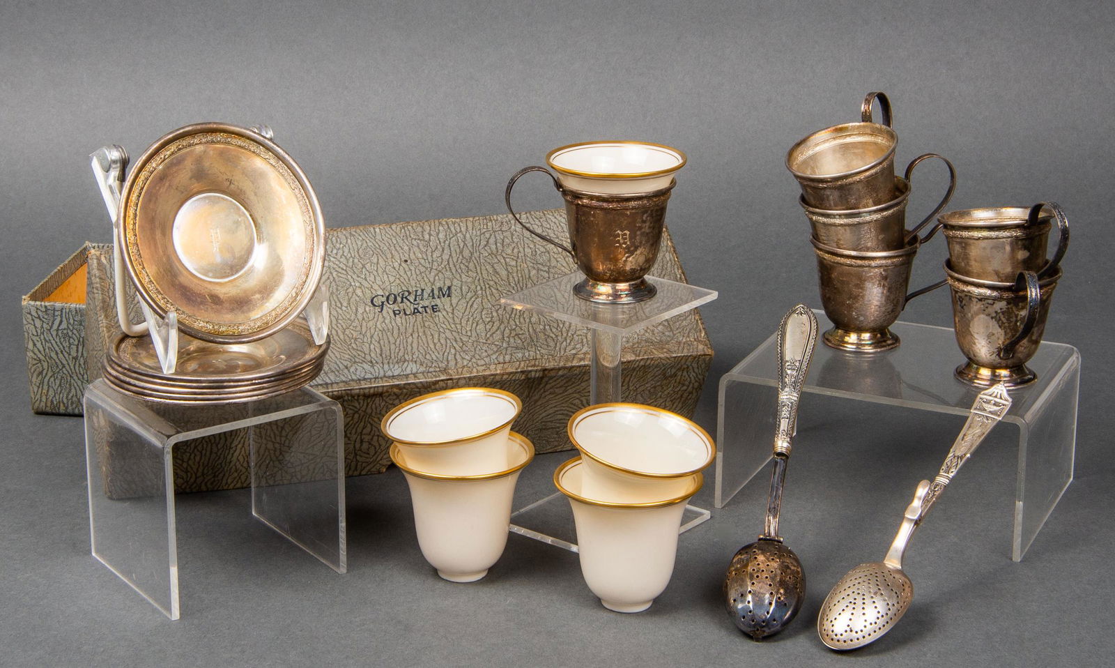 Gorham Sterling Silver Demitasse Set for 6: Gorham sterling silver demitasse set for six, nineteen pieces total, comprising six demitasse cups, six saucers, five Lenox porcelain liners, and two associated tea strainer spoons including one Gorha