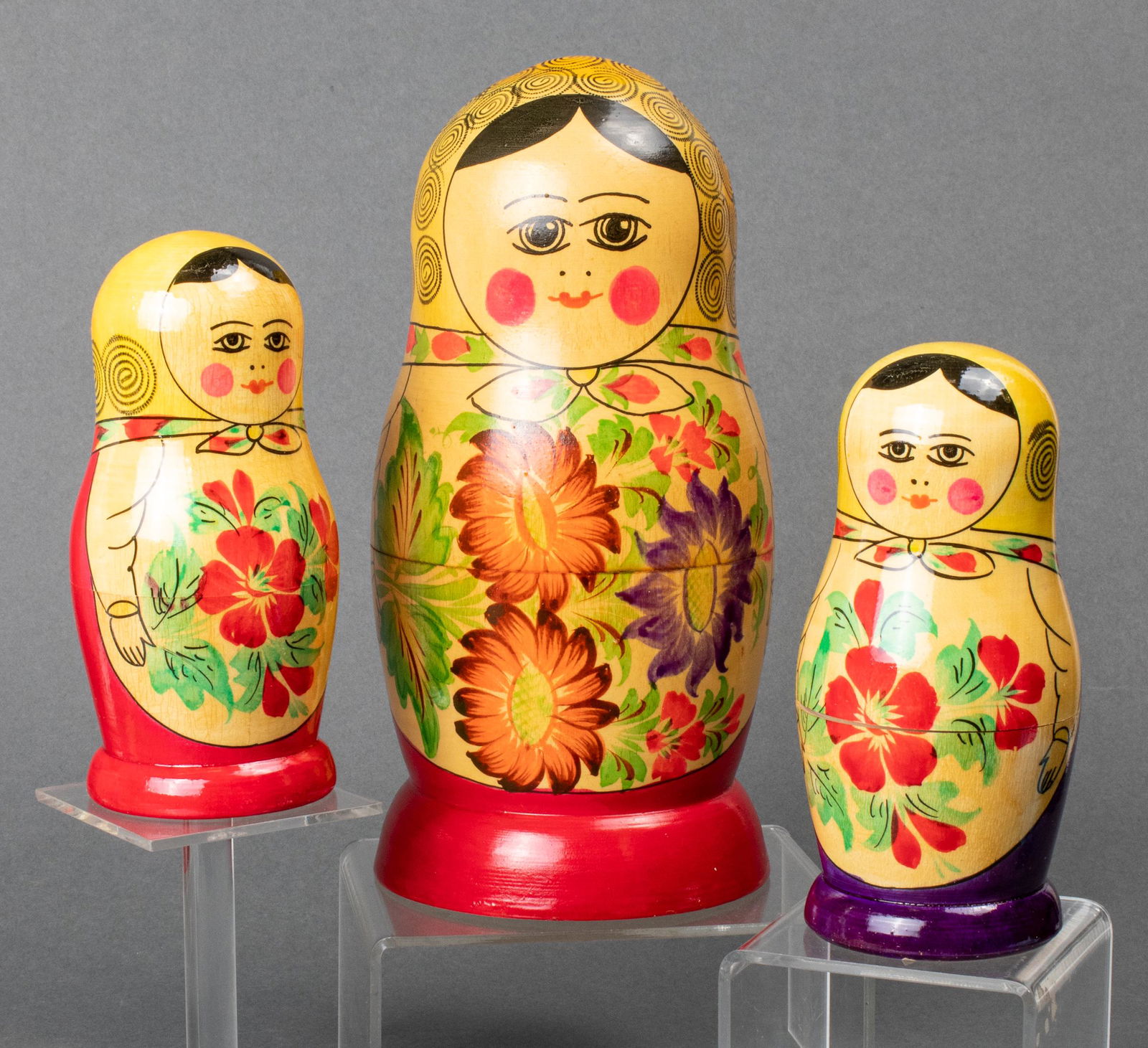 Russian Matryoshka Nesting Dolls, 3: Group of three Russian Matryoshka nesting dolls, the largest with 10 dolls total, each retaining labels, c. 1970s. Tallest: 9" H x 4.25" diameter.