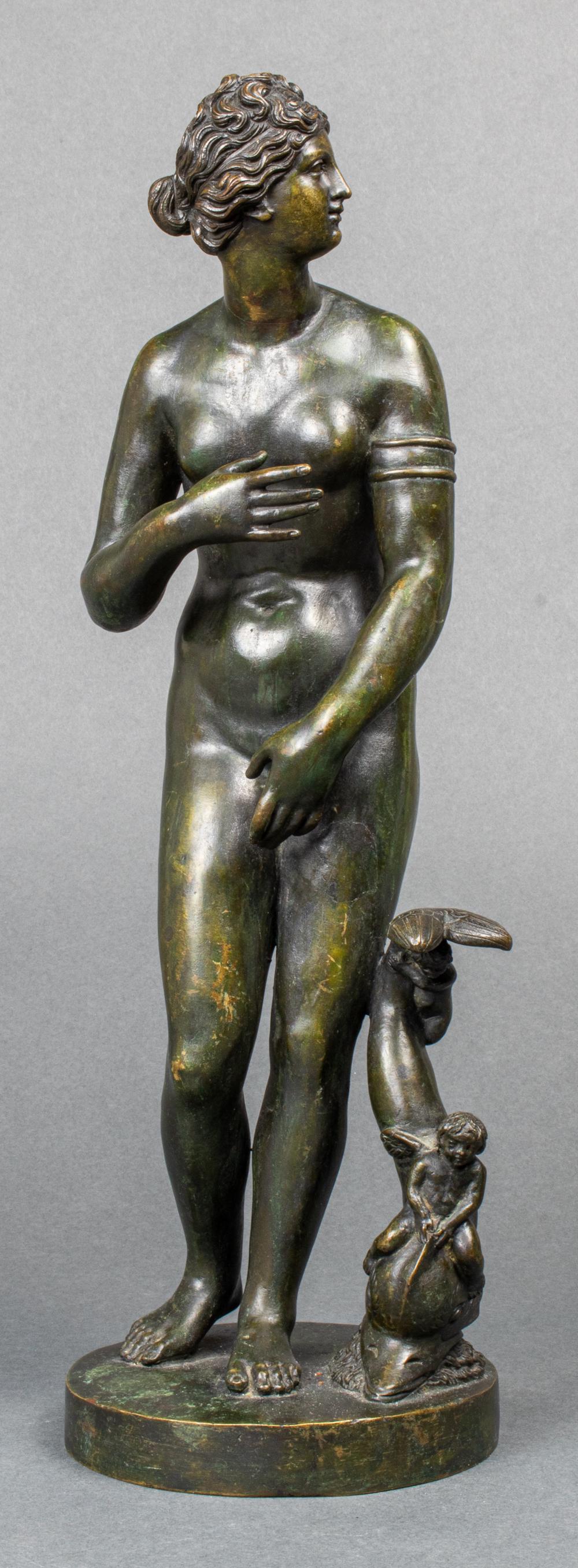 "Venus de Medici" Grand Tour Bronze Sculpture: 19th century Grand Tour bronze sculpture after "Venus de Medici" at the Uffizi Gallery, depicting nude Venus or Aphrodite with cherubs riding dolphin. 13.5" H x 4.25" diameter.