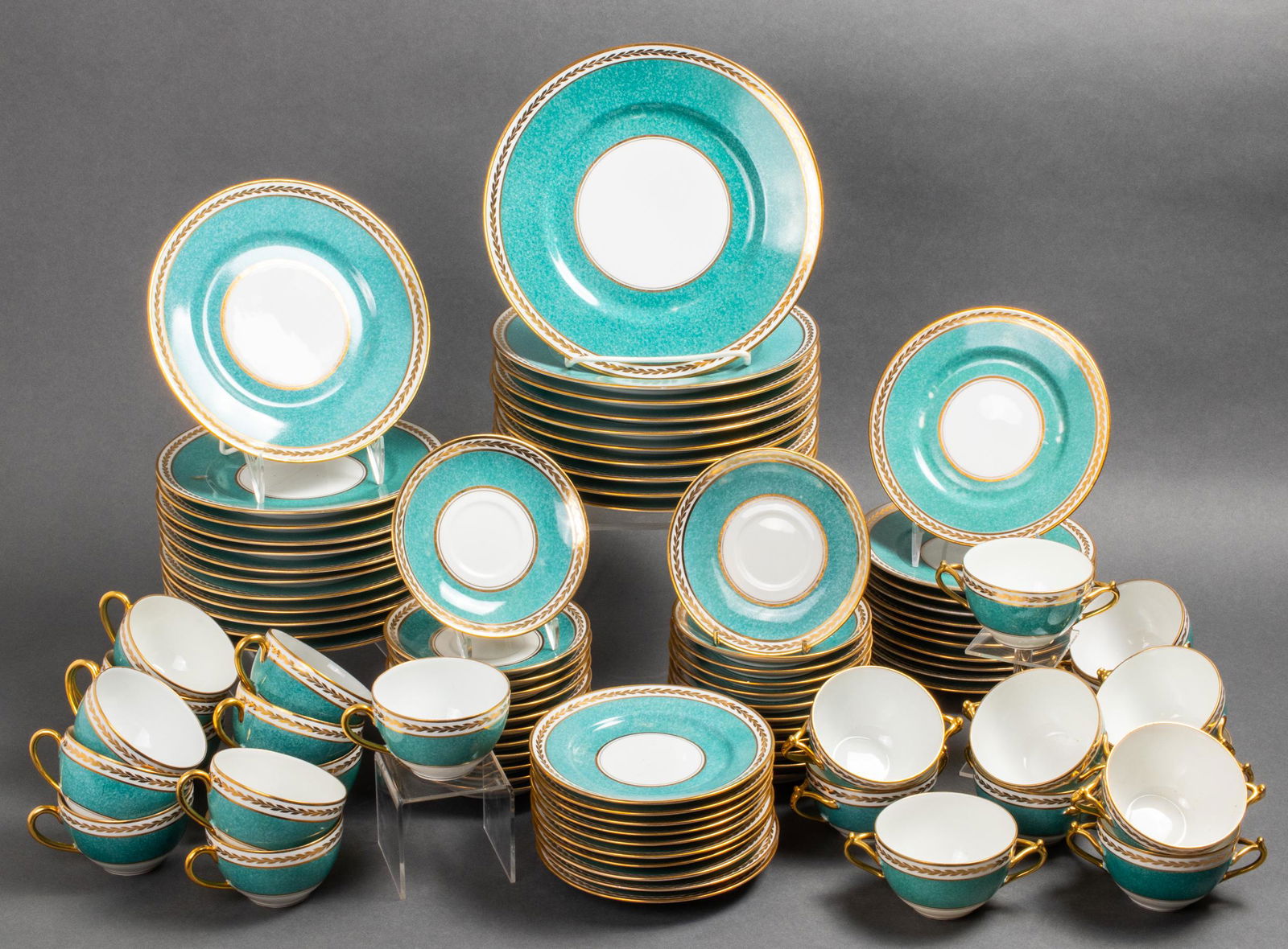 L Bernardaud & Co Limoges Porcelain Dinner Svc 93: L. Bernardaud & Co. Limoges porcelain dinner service for twelve, with turquoise glazed rims and gilt accents, 93 pieces, comprising 12 dinner plates, 12 luncheon plates, 11 salad plates, 10 bread plat