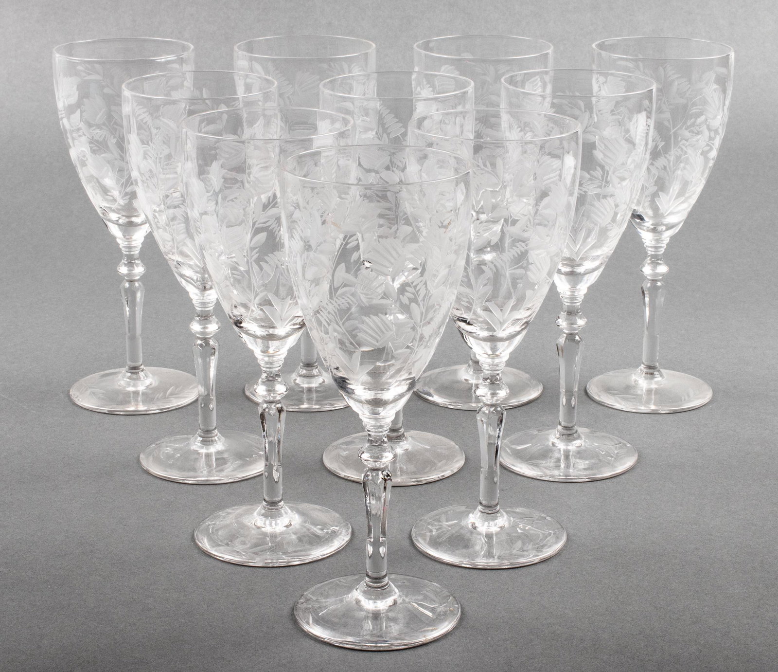 Etched Crystal Stemware Wine Goblets, Set of 10: Set of 10 etched crystal stemware wine glasses, with frosted floral motif. 7.75" H x 3" diameter.