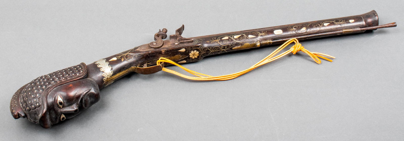 Ottoman Blunder Buss w Carved Head Club, Antique: Antique Middle-Eastern flint-lock blunder buss or kuber pistol, likely Turkish / Ottoman, terminating in a carved warrior head form club, the barrel with bone and silver wire inlay with cast relief pa