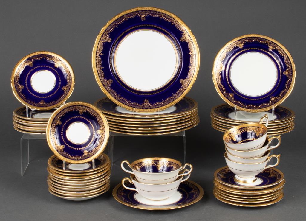 Aynsley Porcelain Partial Dinner Service, 47: Aynsley partial dinner service, the rims with gilt Georgian and Imperial motifs on a cobalt blue ground, 47 pieces, comprising 8 dinner plates, 8 lunch / dessert plates, 5 bread / salad plates, 2 soup
