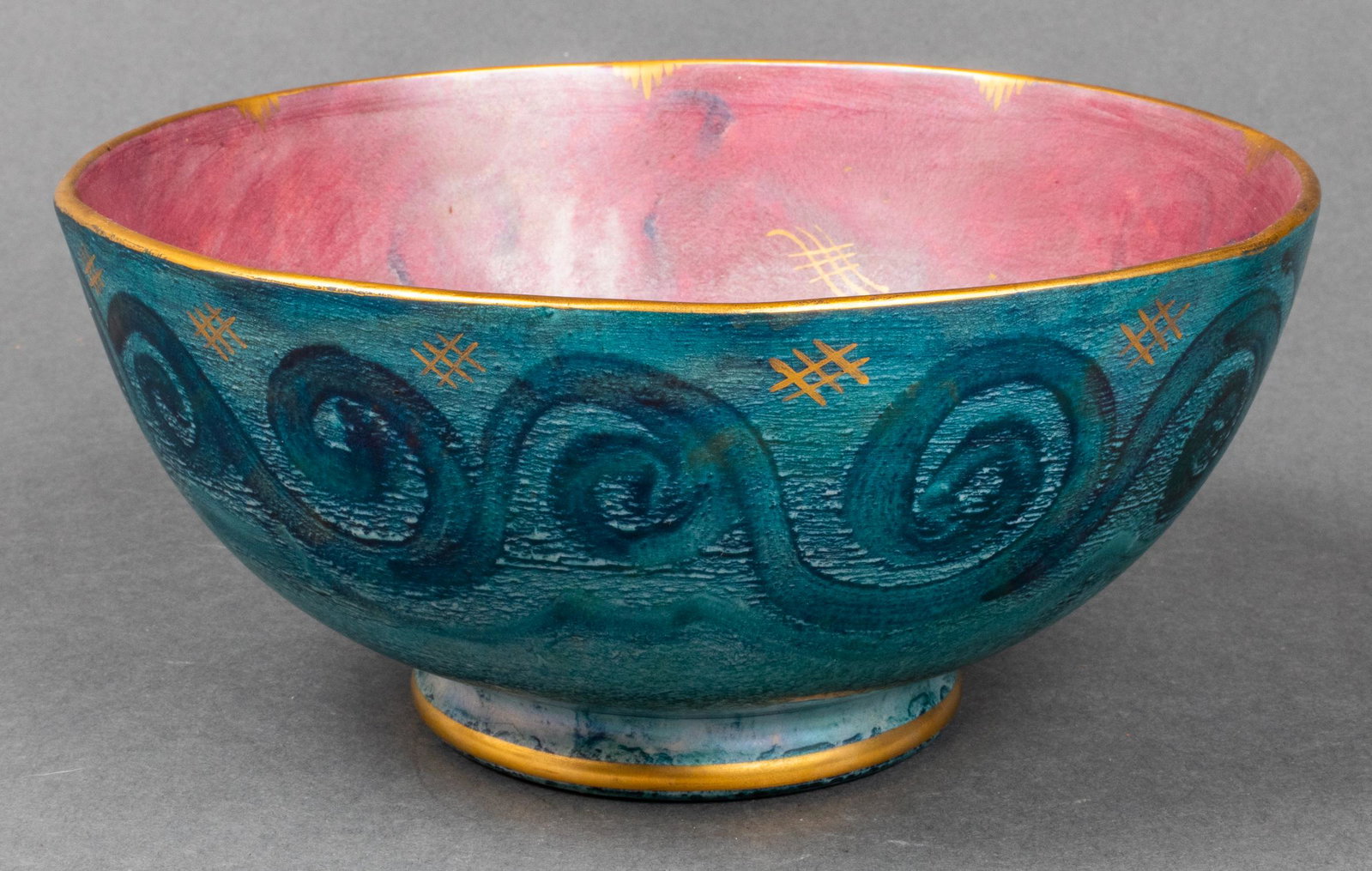 Gustavsberg Sweden Glazed Art Pottery Bowl: Gustavsberg Sweden art pottery / ceramic bowl, turquoise and red glaze with gilt detailing, maker's mark underside along with artist's monogram and "1927." 4" H x 8.75" diameter.