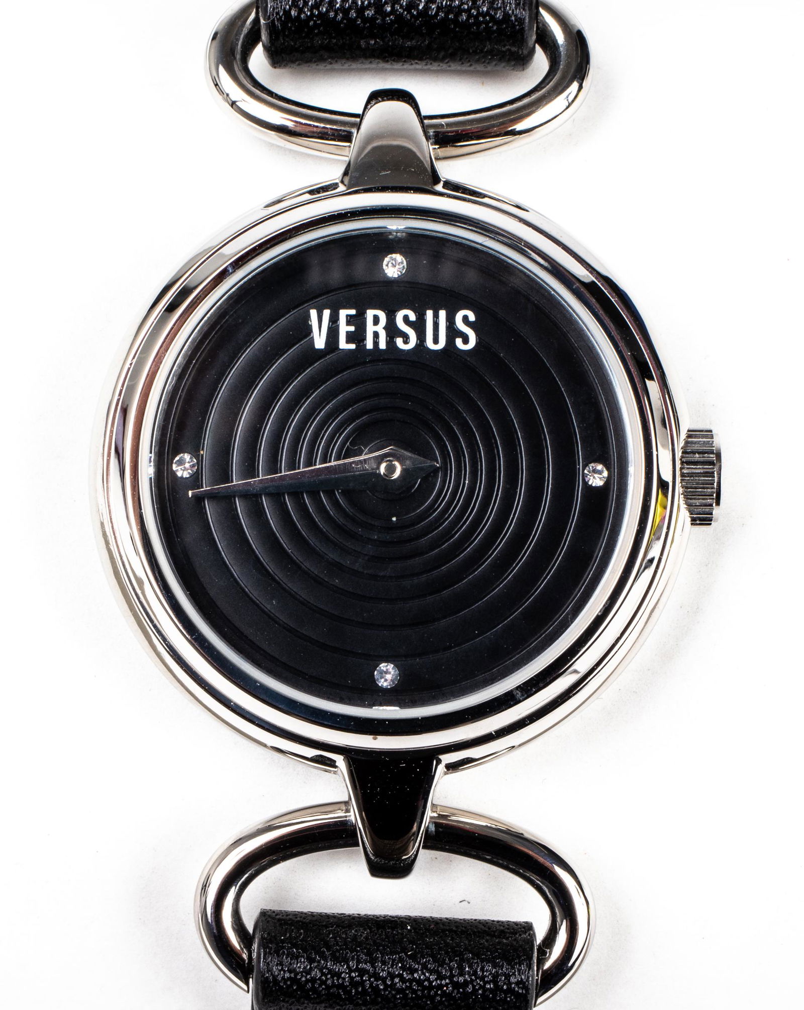 Versus Versace Black Leather & Stainless Watch: Versus by Versace wristwatch, having a stainless steel case with a black concentric circle dial and black leather band, water resistant, with original box and bag. #3C67700000. Case: 30mm.