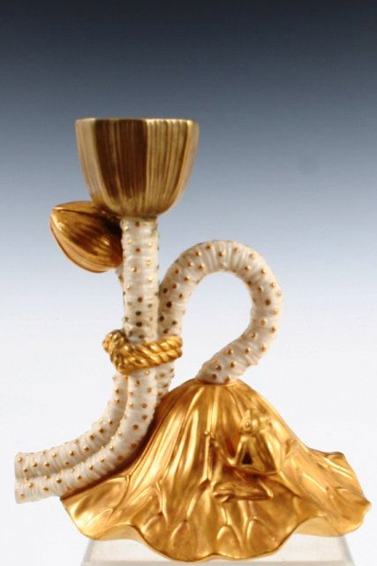 Royal Worcester Frog-on-Leaf Candlestick 1889: Charming porcelain candlestick in the shape of a flower bud supported by stems on a frog-on-leaf base; hand-gilded decoration. Manufactured by Royal Worcester, England, 1889; factory mark and serial n