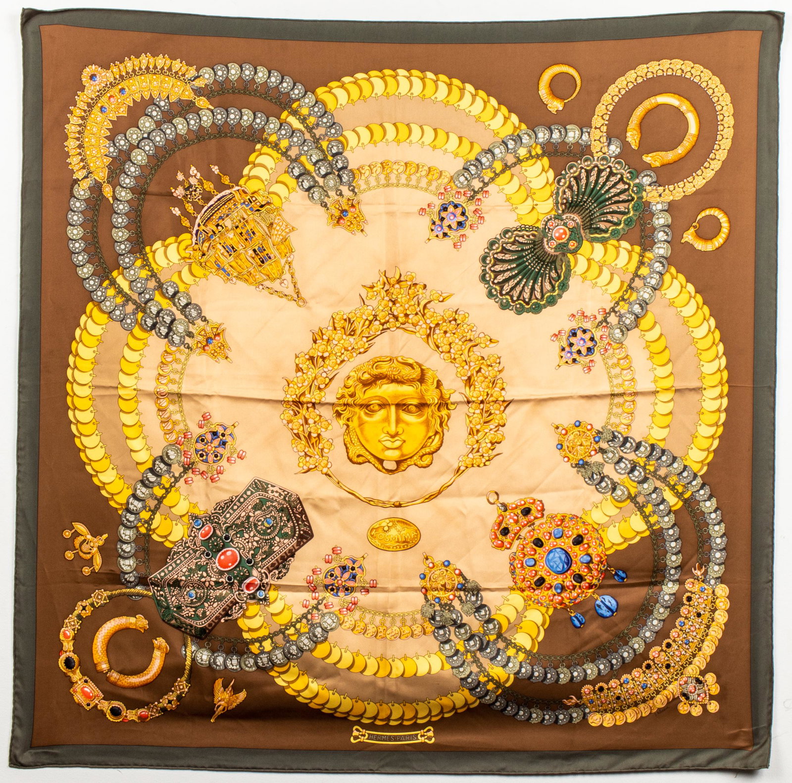 Hermes "Kosmima" Silk Scarf: Hermes silk scarf, "Kosmima," original design by Julia Abadie, with masque and jewel motifs, signed: "Hermes Paris." 35" square. Areas of minor soiling, minor pulls at edges.