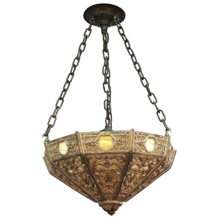 Art & Crafts Slag Glass Pendant Chandelier: Arts and Crafts Renaissance or Gothic revival inspired pendant chandelier with slag glass set into an ornate grotesque motif metal frame. 34" H x 22" D.
