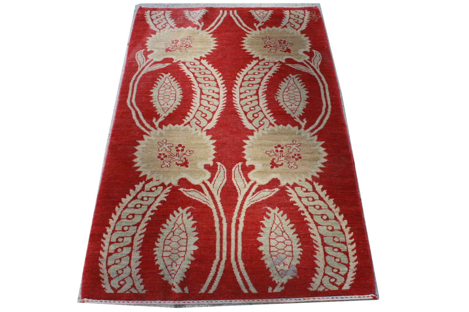 Arts & Crafts Manner Red Area Rug 3' x 4' 11": Arts and Crafts manner area rug, floral motif on red ground. 3' x 4' 11". Surface wear from prior use, fading, soiling.