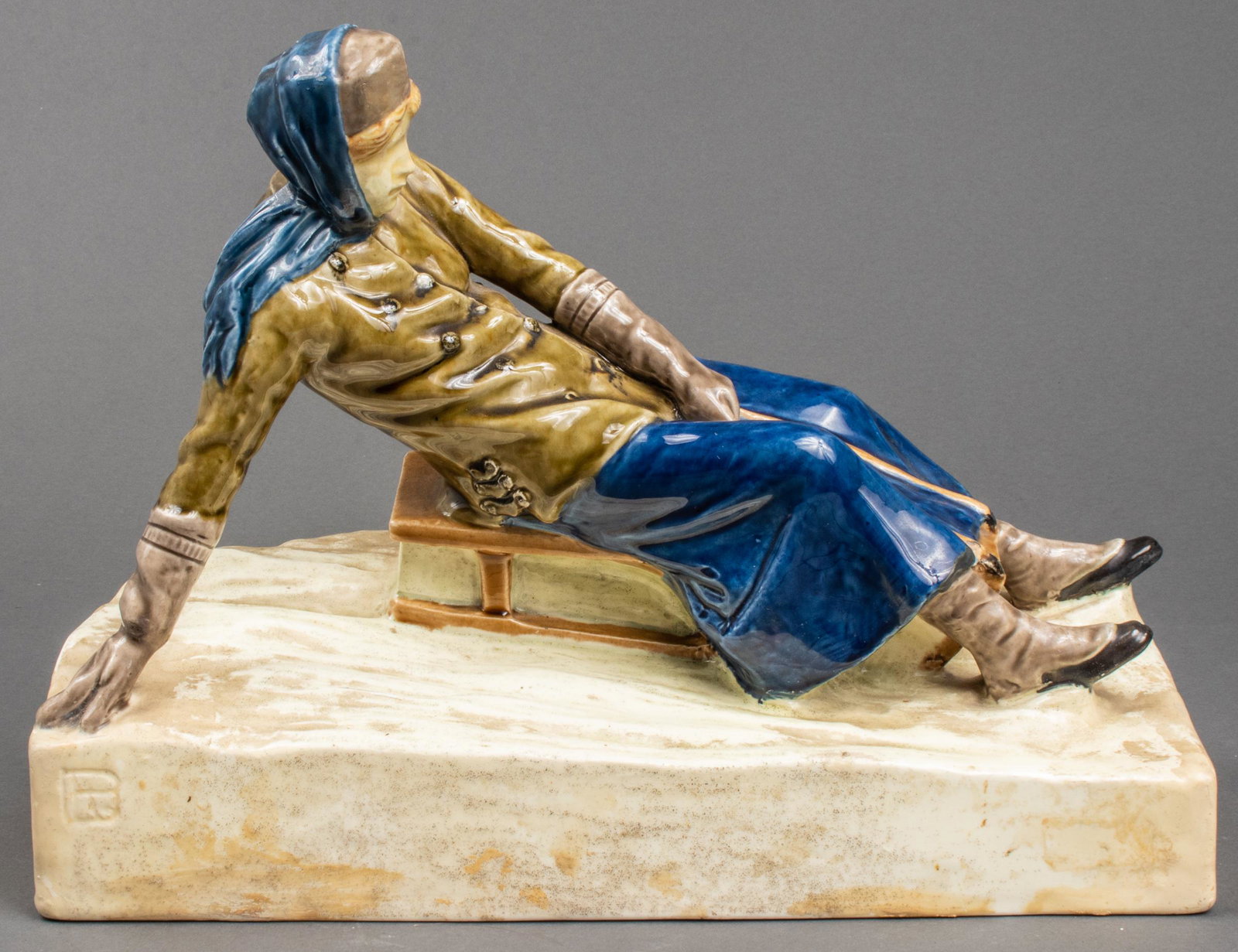 Ceramic Sculpture of 19th c. Woman Sledding: Ceramic sculpture of 19th c. woman sledding, stamped and incised illegibly to underside, also note illegible incised mark to base at left. 9.5" H x 13" W x 6" D.