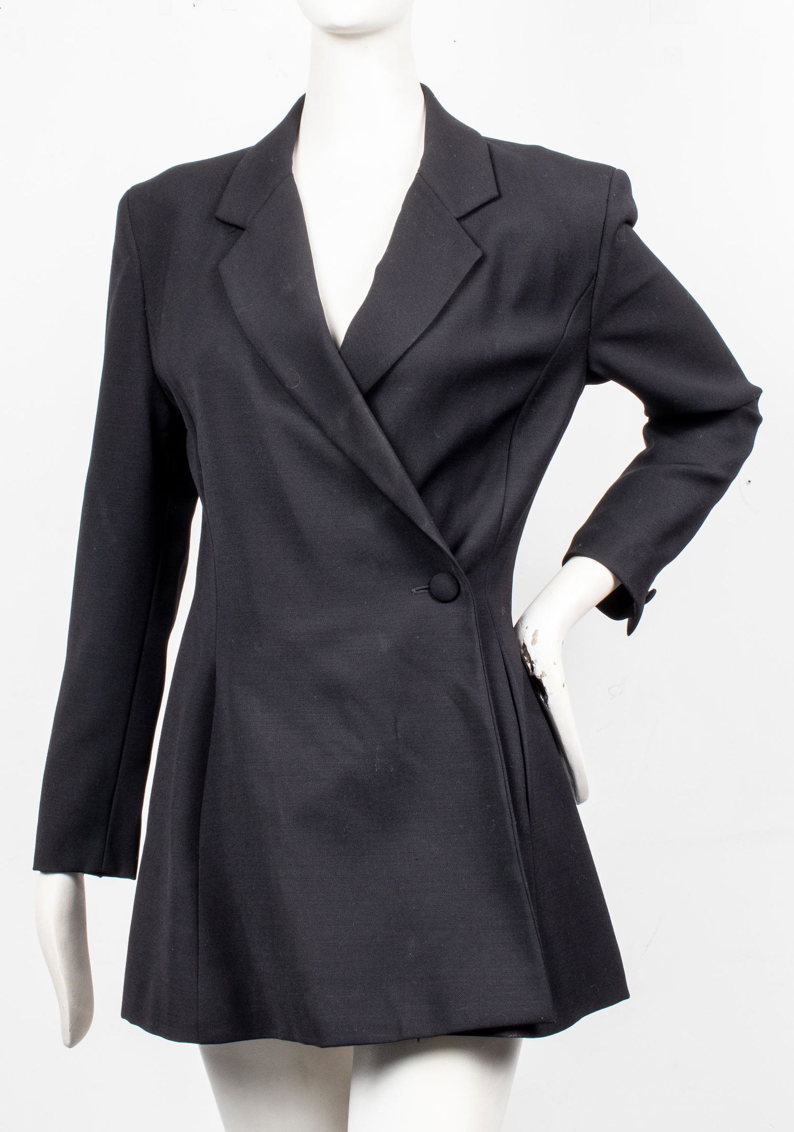 Byblos Italy Wool Suit Blazer: Byblos Italy wool suit blazer / jacket, notched lapel with wide overlap and single button closure to side, dual side pockets, designer's label and size "Byblos Made in Italy / 40" to interior. Shoulde