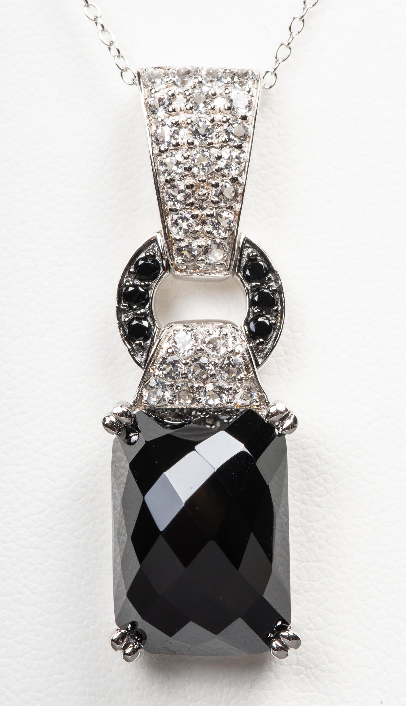 Silver Onyx & White Spinel Pendant Necklace: Silver onyx and white spinel pendant necklace, marked: "925/ CHINA/ TC". Pendant: 1.75"L x 0.5"W. Chain: 18.0"L x 0.062"W. Approx: 0.33 ozt. inclusive.