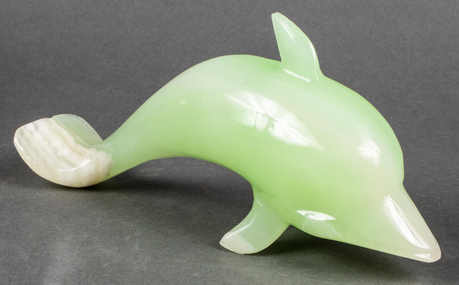 Carved Dolphin Sculpture / Paperweight, Onyx: 5" H x 10.75" L x 2.75" D. Minor chip losses.