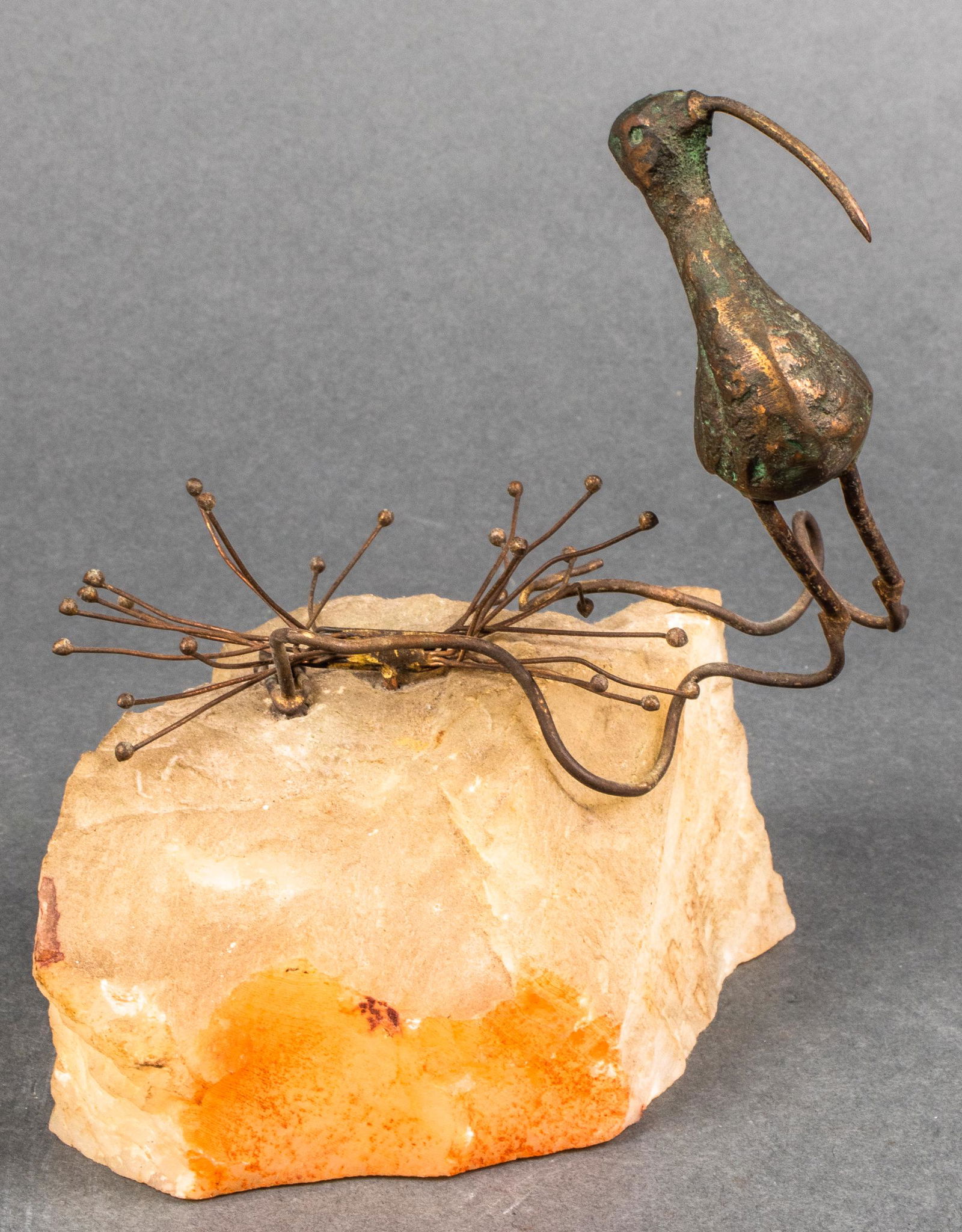 Curtis Jere Style Bronze & Stone Bird Sculpture: In the style of Curtis Jere, bronze bird and grass in Brutalist manner mounted to raw stone base. 7" H x 7" W x 4.25" D.