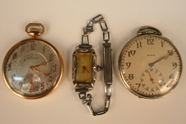 2 Antique Pocket Watches & 1 Ladies' Wristwatch: 1 Majestic 14 kt gold-filled pocket watch featuring a silver dial, 16 J movement with 3 adjustments; 1 Elgin 14 kt white gold pocket watch, ca. 1931, with 17 J movement adjustments; 1 Cyma LDS 18 kt w