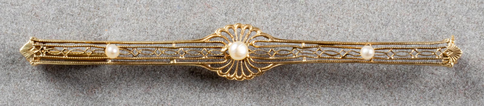 Edwardian 14K Yellow Gold & Seed Pearl Bar Pin: Antique Edwardian 14K yellow gold and seed pearl filigree bar pin, marked: "14K." 2.0" L x 0.312" W at widest section x 0.25" H. Approx: 1.8 dwt inclusive. Provenance: Removed from an estate at 1199 P