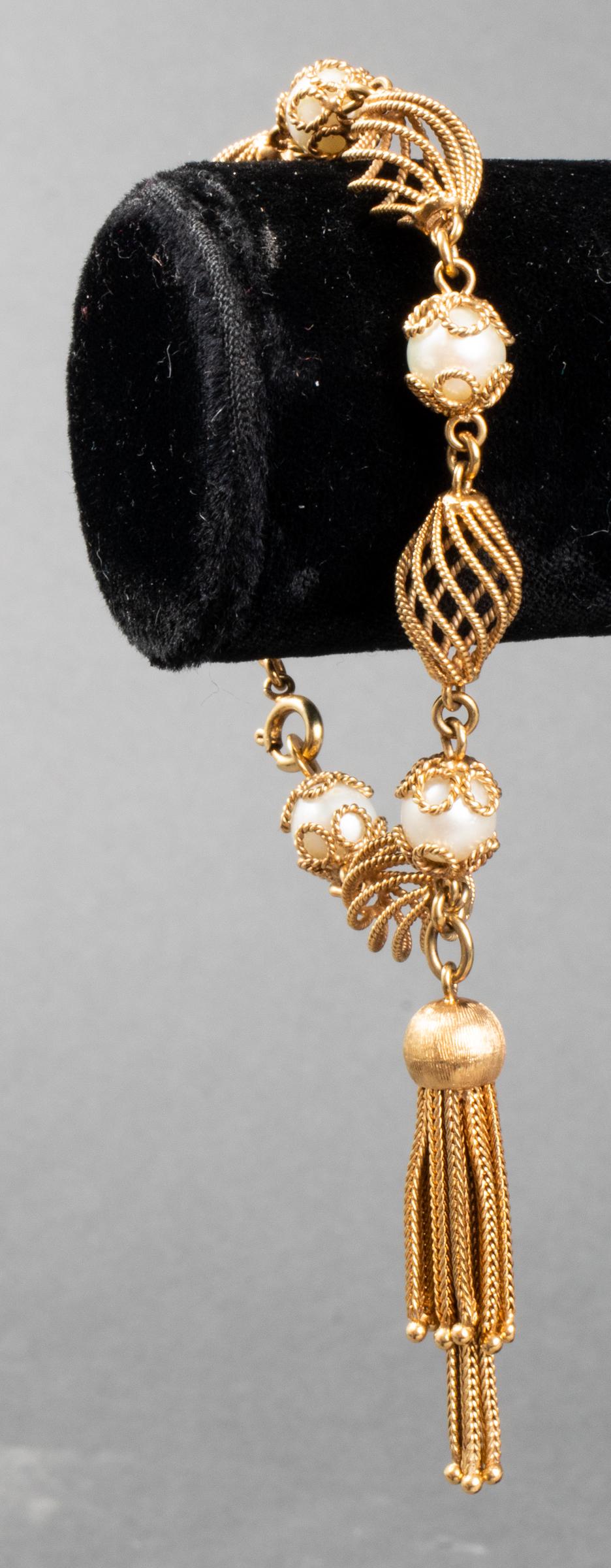 Vintage 14K Yellow Gold Pearl Tassel Bracelet: Vintage Italian 14K yellow gold ornate open wire bead and pearl tassel bracelet, with five 7mm cultured pearls, marked: "ITALY / K14 / MEP / 477 / 887." Bracelet: 7.5" L x 0.43" W; tassel: 1.87" L x 0