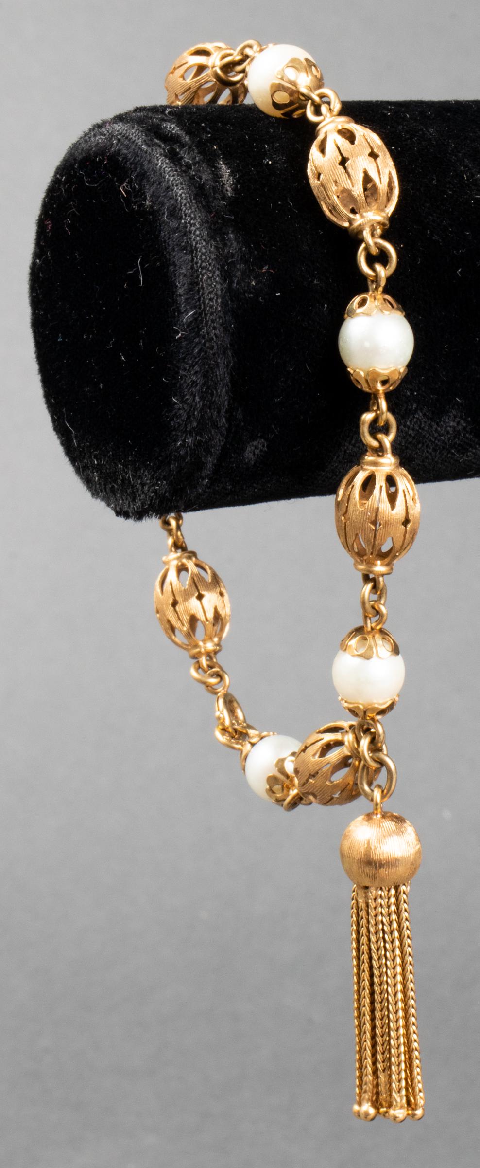 Vintage 14K Yellow Gold Pearl Tassel Bracelet: Vintage Italian 14K yellow gold filigree bead and pearl tassel bracelet, with six ornately capped 7 mm cultured pearls, marked: "ITALY / 14K / MEP/ 887." Bracelet: 8.25" L x 0.312" W; tassel: 1.5" L x