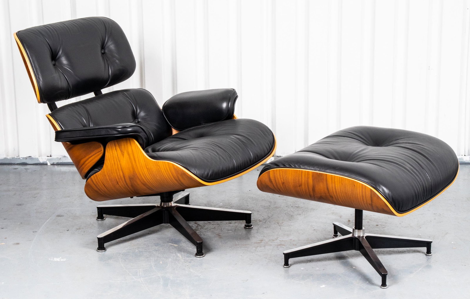 Eames for Herman Miller Chair & Ottoman: Charles and Ray Eames for Herman Miller contemporary mid-century modern design lounge chair and ottoman, model numbers 670 and 671, with maker's label underside. Chair: 31” H x 32” W x 35” D; ot
