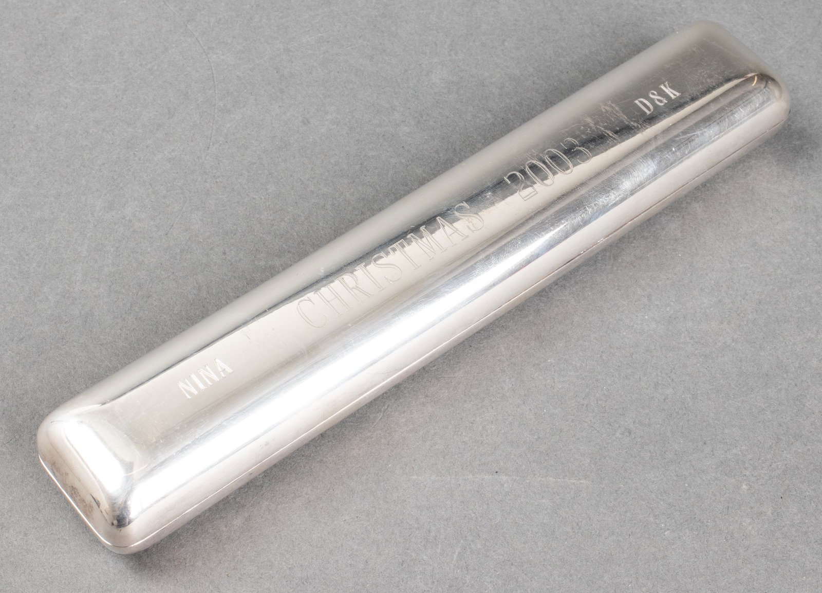 Gucci Sterling Silver Hinged Toiletry Case: Gucci sterling silver toiletry case, hinged form with one cover bearing "Gucci" logo, the other inscribed: "Nina Christmas 2003 D+K," stamped maker's marks on interior lip: "925 / 14 202 (star) / Made