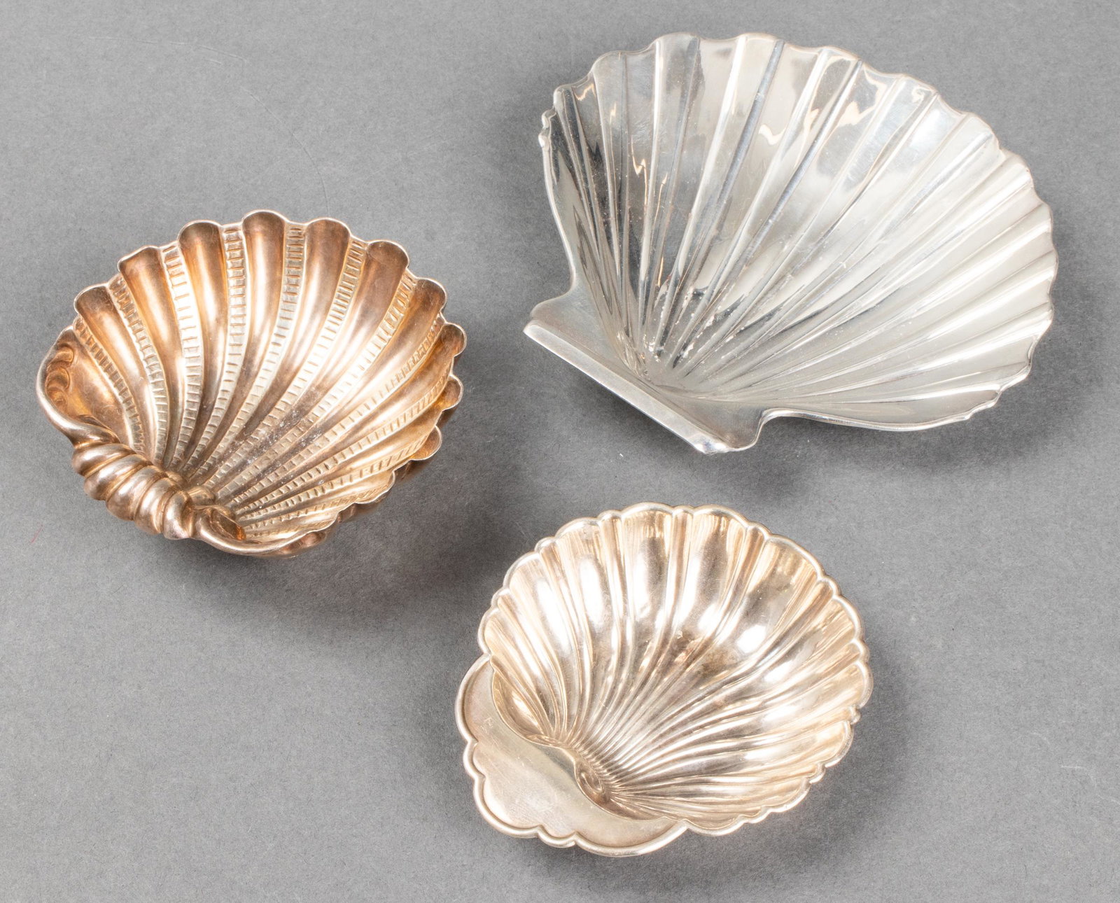 Silver Seashell Dishes incl. Missiaglia, 3: Trio of sterling silver seashell form dishes, including one Missiaglia and two Gorham, all with stamped maker's marks on reverse. Largest: 4.5" H x 4.75" W. Approx: 5.96 ozt. Provenance: Property from