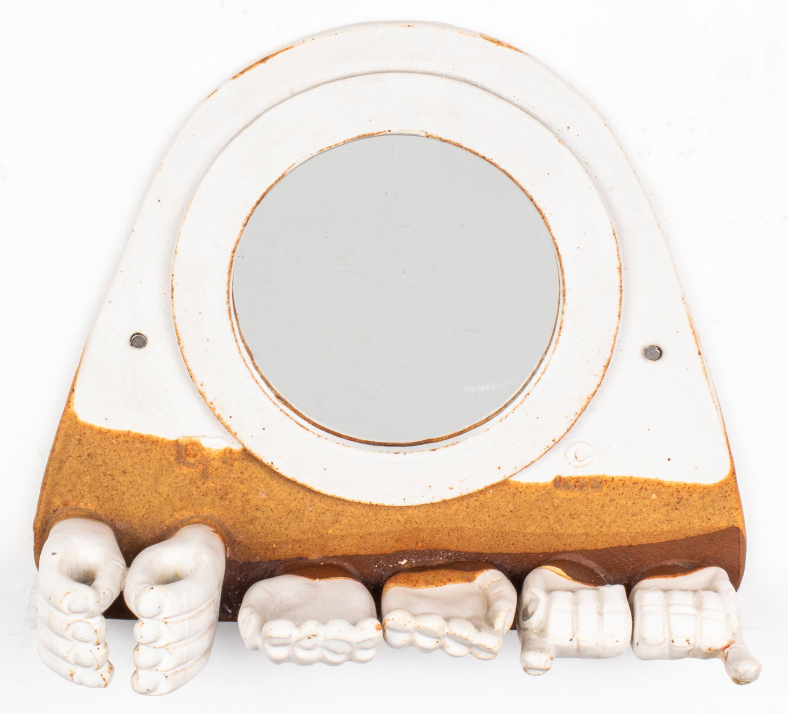 Vintage Pottery Vanity Mirror with Hand Motifs: Vintage art pottery vanity mirror, with relief molded hands to function as toothbrush holders, soap dish, etc., impressed date mark: "1973." 10.25" H x 12" W x 3.5" D. Hairlines on proper left pinky.