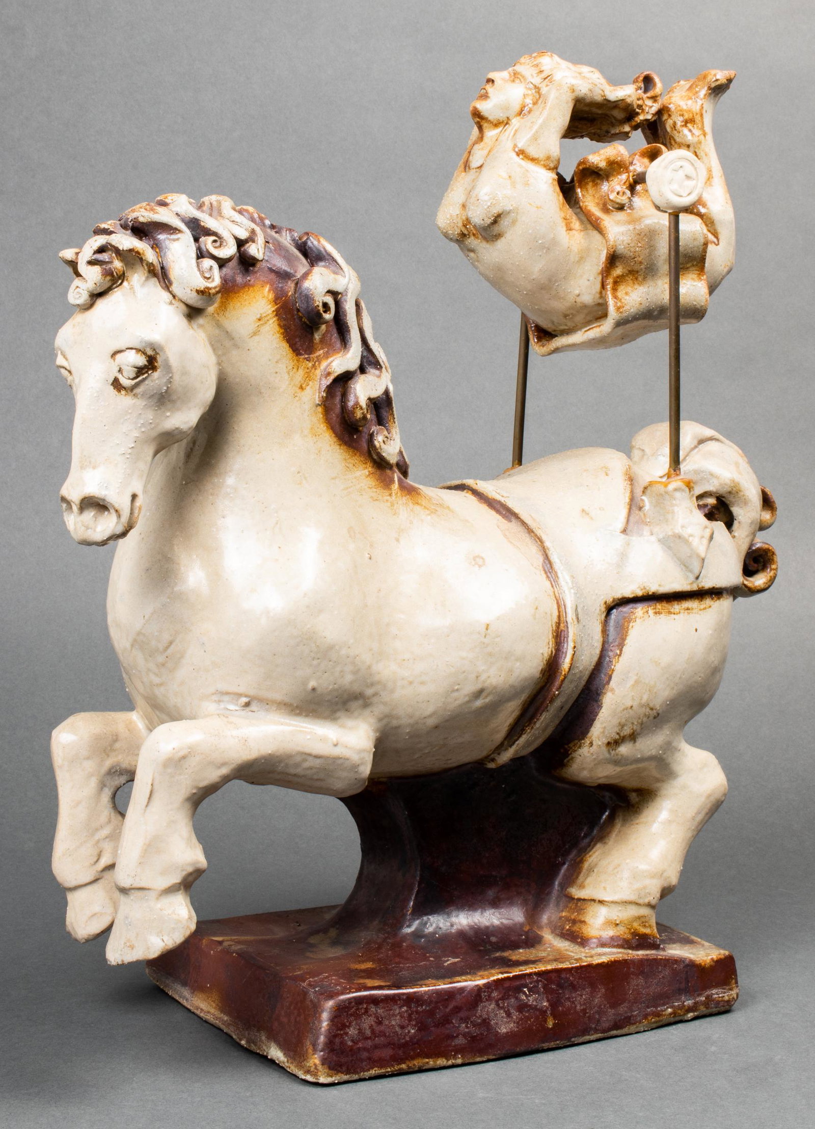 Jon Carlos Lopez "High Flyer" Ceramic Sculpture: Jon Carlos Lopez (American, b. 1940) "High Flyer" modern ceramic sculpture, 1976, depicting kinetic circus acrobat over horse, signed and dated underside. 16.5" H x 14" L x 6" W.
