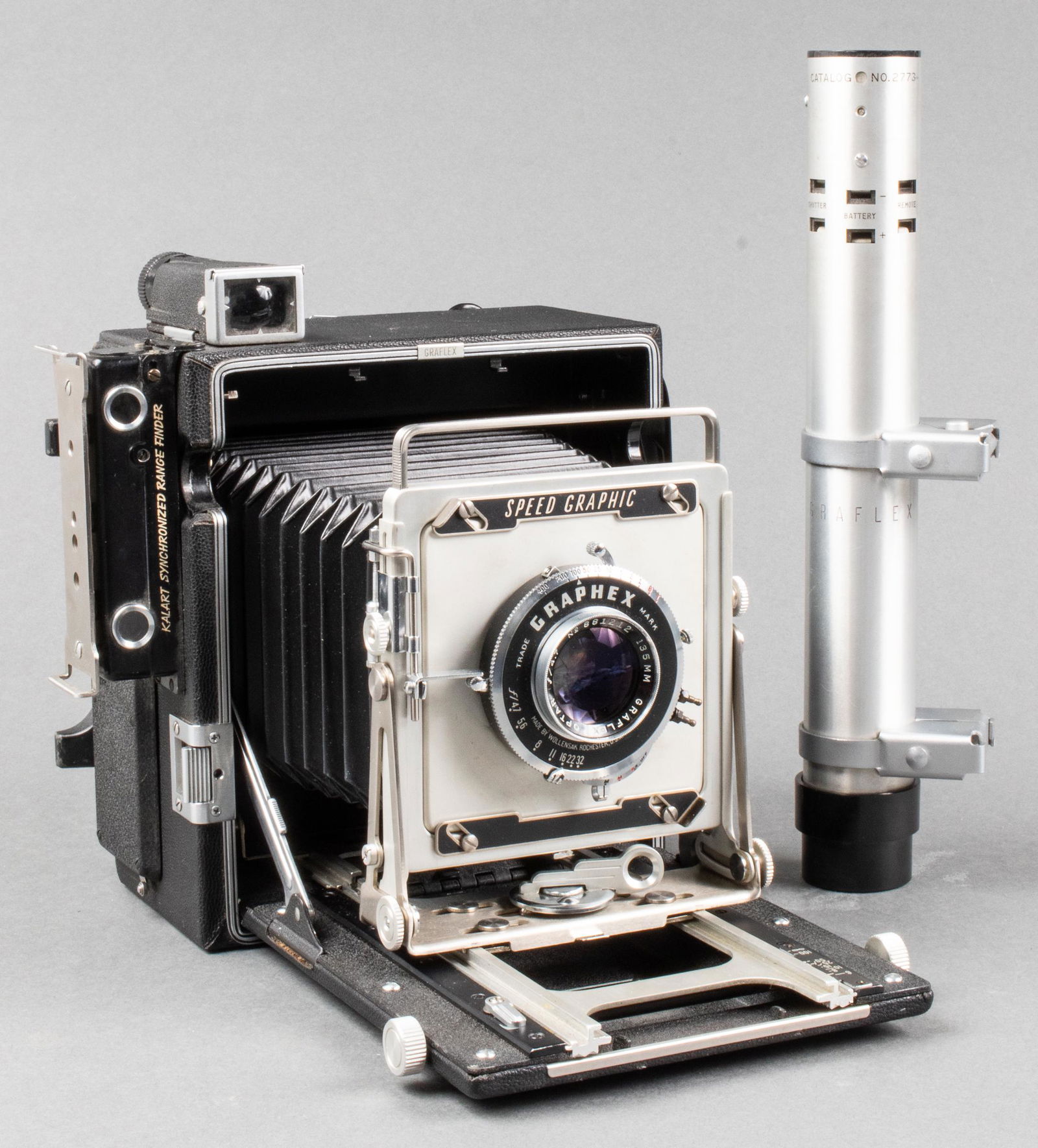 Graflex Pacemaker Speed Graphic 4 x 5 Camera: Graflex Pacemaker Speed Graphic 4 x 5 camera with Graflight synchronizer flash attachment, lens: 135mm 1:4.7. 12" H x 10" W x 4.5" D.