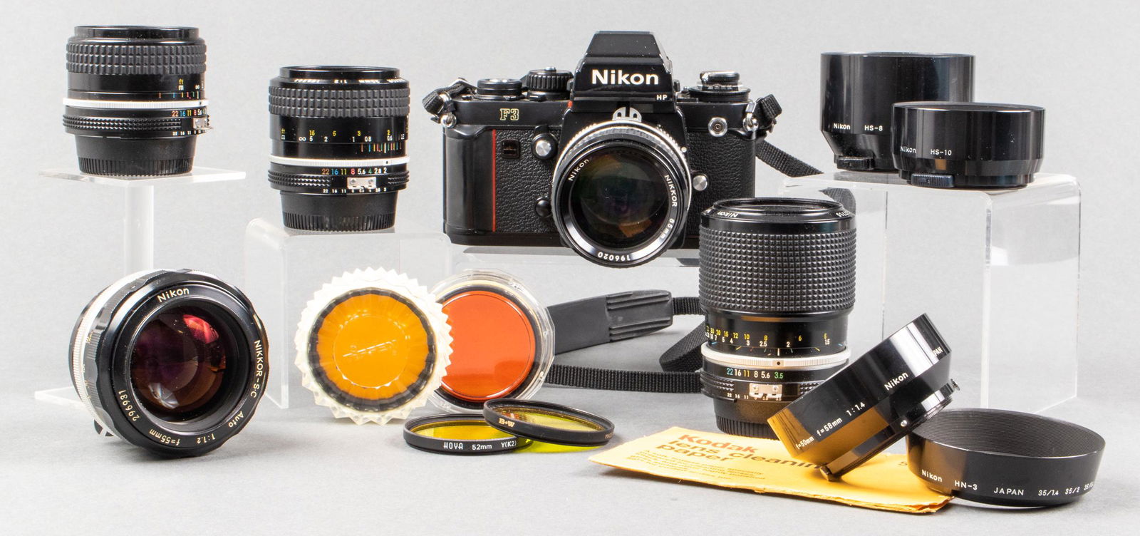 Nikon F3 with Five Nikon Lenses & Accessories: Nikon F3 35mm SLR camera, with five Nikon lenses, including one Nikon Nikkor-SC auto 55mm 1:1.2 lens, one Nikon Nikkor 85mm 1:2 manual lens with no lens cap or back cap, one Nikon Nikkor 35mm 1:2 manu