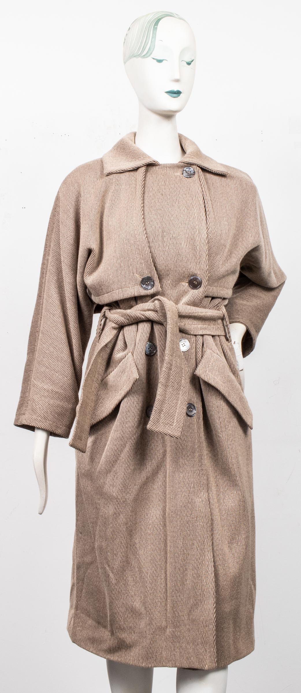 Celine Paris Long Coat: Celine Paris long coat, the double breasted front with logo button closure and two slant pockets, the interior with satin lining and "Celine Paris" label, lacking fabric and size labels. Collar to hem