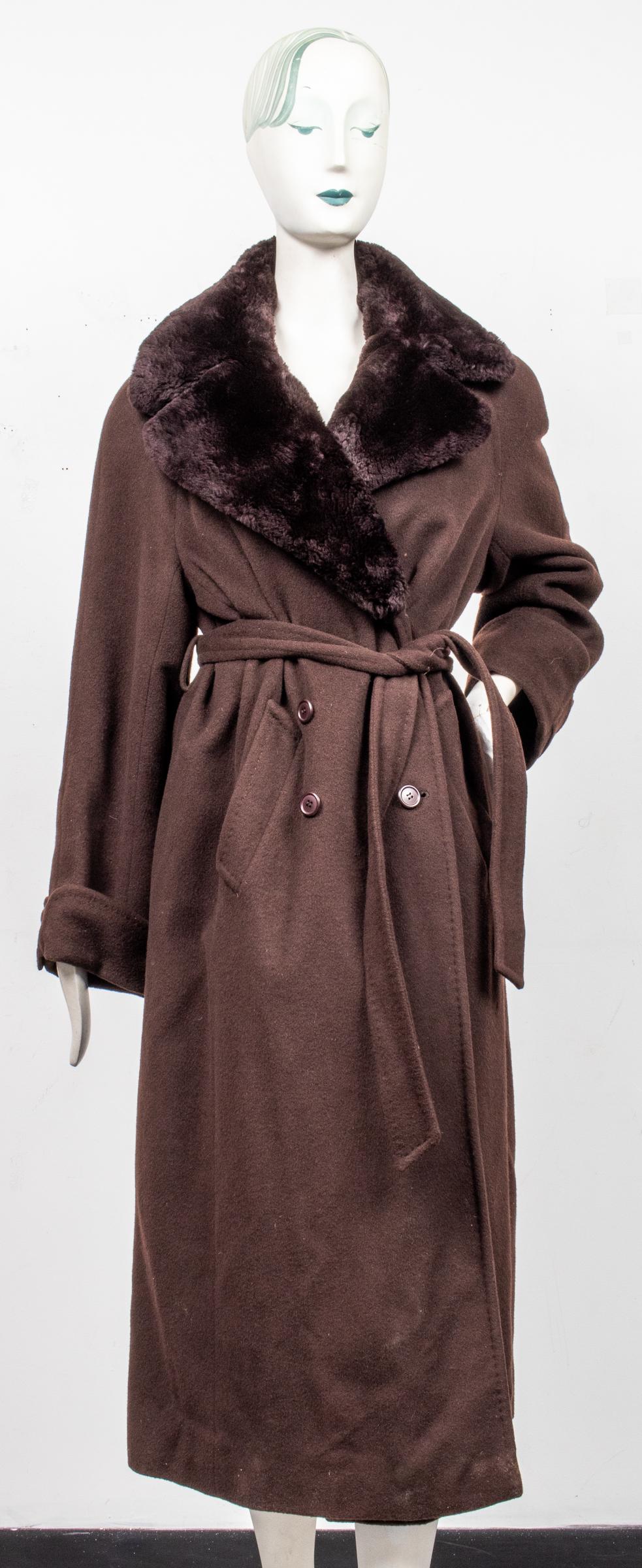Searle Faux Fur Trimmed Cashmere Coat: Searle faux fur trimmed brown cashmere long coat with notched lapels, double breasted button and belted waist closure, two slant pockets, sleeves with button detail, the interior with satin lining and