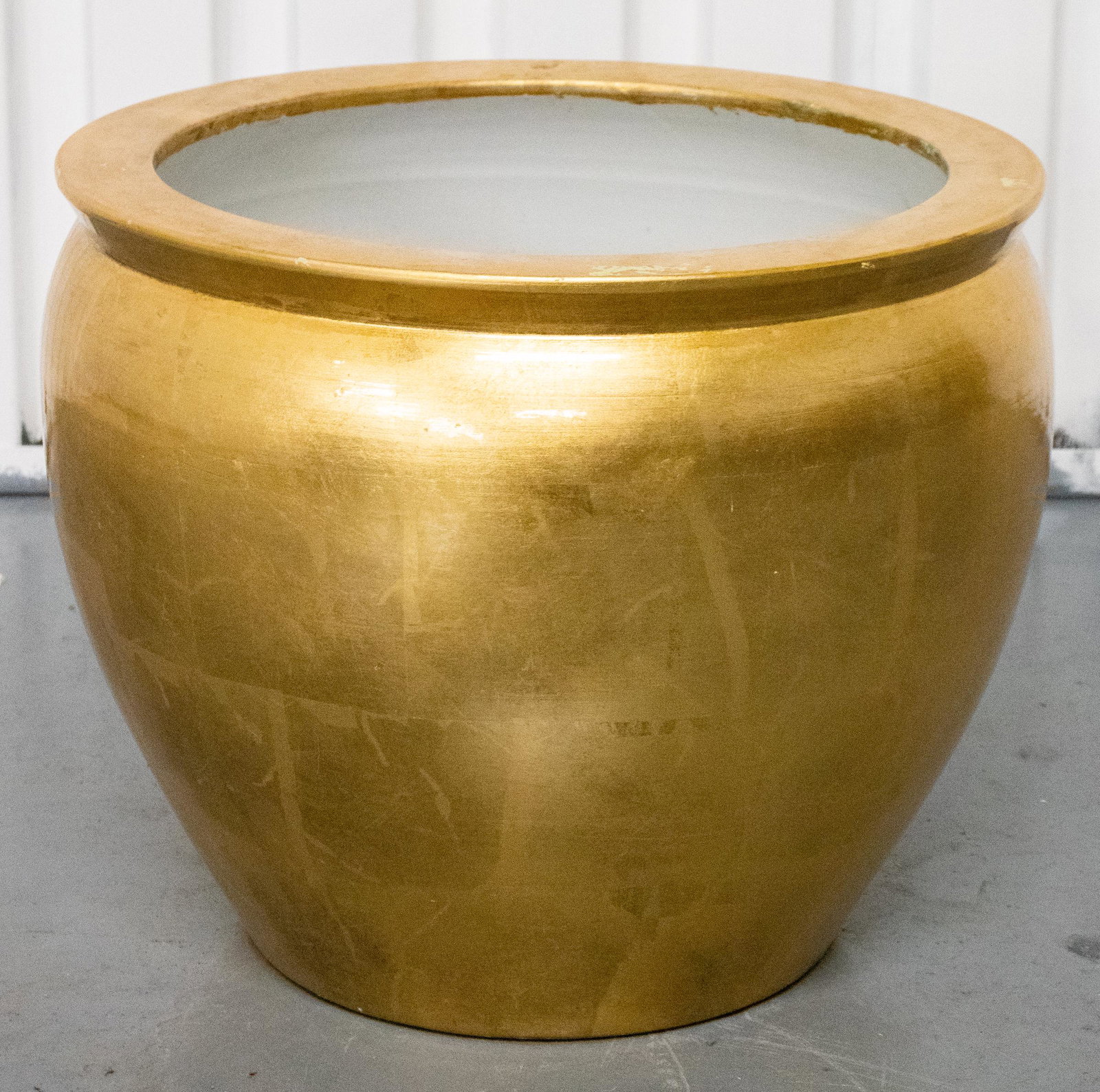 Large Modern Gilt Earthenware Jardinière: Modern gilt round earthenware jardinière. 18” H x 21” diameter.