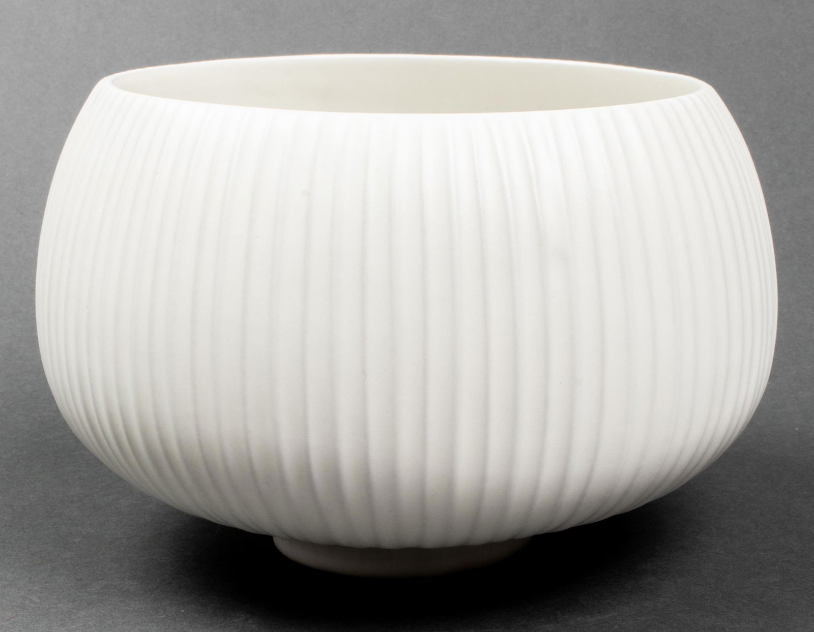 Vintage Jonathan Adler "Vidalia" Stoneware Bowl: Jonathan Adler white stoneware "Vidalia" bowl from the "Relief Collection," glazed with satin matte finish, maker's mark to underside. 6.25" H x 8" diameter. Provenance: Removed from a Kip's Bay colle