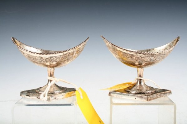 Pair of Silver Salt Cellars c 1820 German: Pair of silver salt cellars with a pointed oval shape and engraved floral bands on pedestal bases, German ca. 1820; marked on base. Dimensions: Approximately 3-1/2"H x 4"H