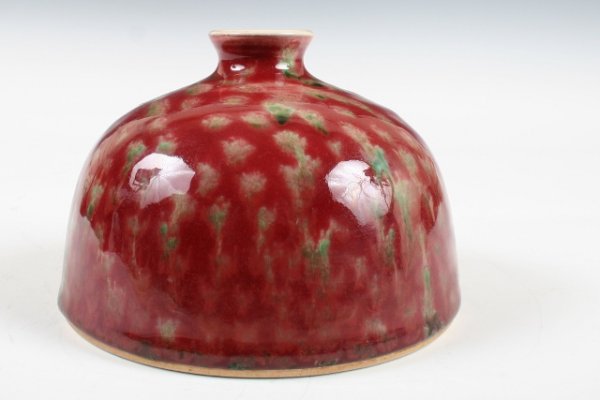 Chinese Kangxi-Era Red-Glazed Water Pot: Chinese porcelain beehive water pot on a shallow foot ring, Kangxi mark and period (1661-1722). Decorated with copper-red glaze over green underglaze. The copper-based, " apple-red" glaze wa
