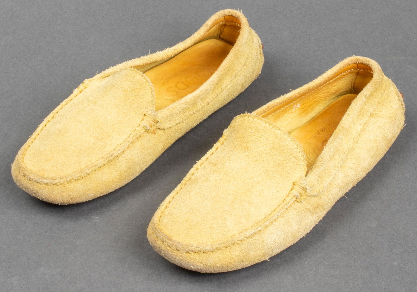 Tods Suede Gommino Driving Shoes, Size 7.5: Tods Gommino suede loafers in mustard yellow, made in Italy. Signs of wear noted.