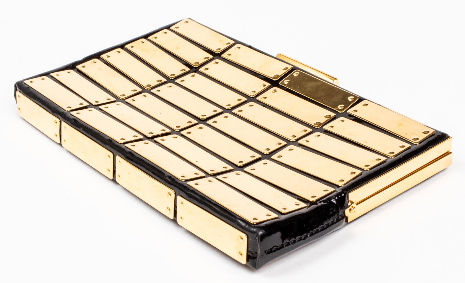 Jimmy Choo Black Patent Leather Clutch: with gold tone hardware, the interior with tan alcantara fabric lining and "Jimmy Choo" label. 5.25” H x 8.75” W x 1” D