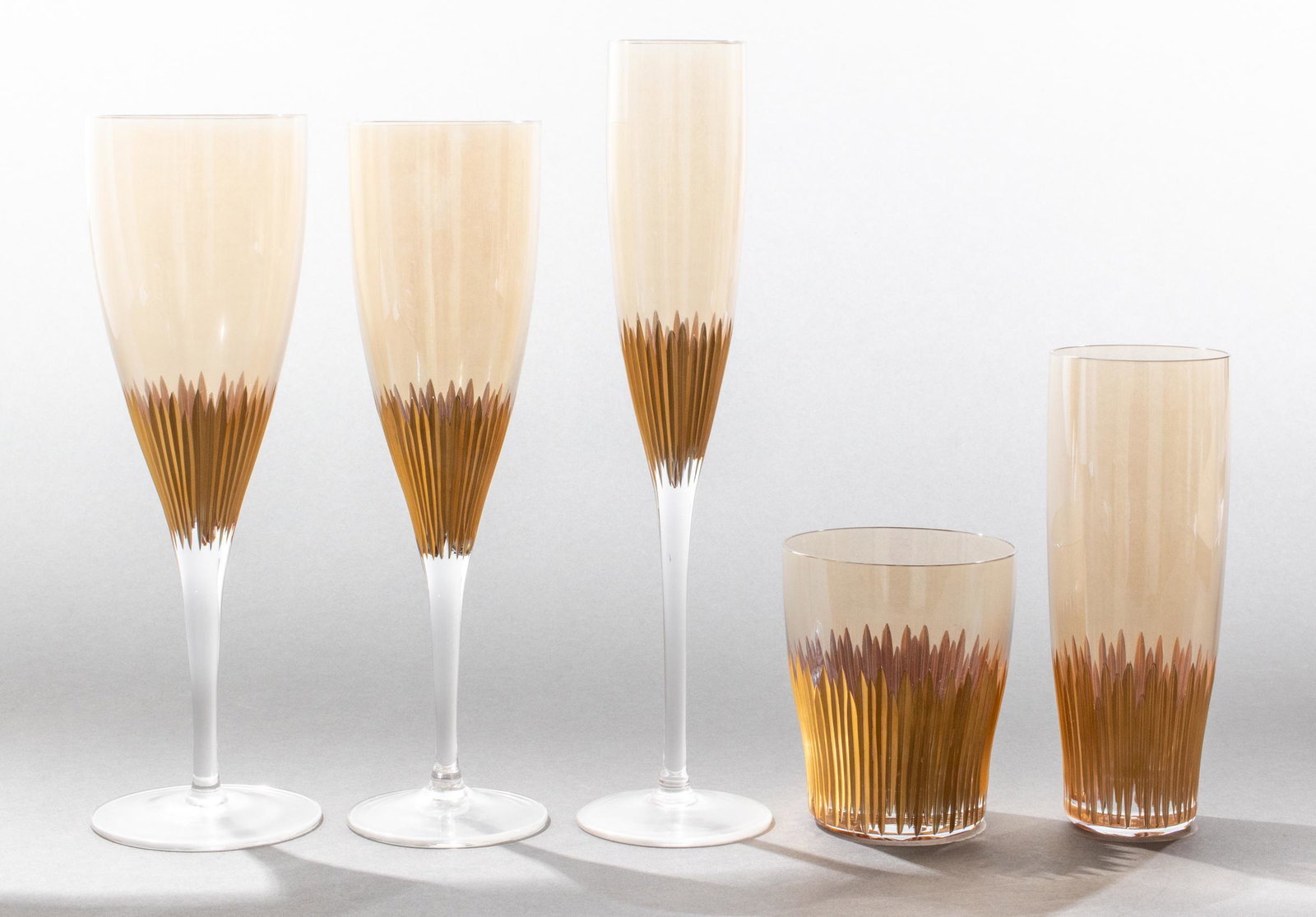 Extensive Modern Gilt Sunburst Stemware Service: Extensive service of modern parcel gilt stemware / barware with sunburst decoration, 58 pieces, some with stickers marked: "Made in Poland," comprising 12 white wine glasses, 11 red wine glasses, 12 c