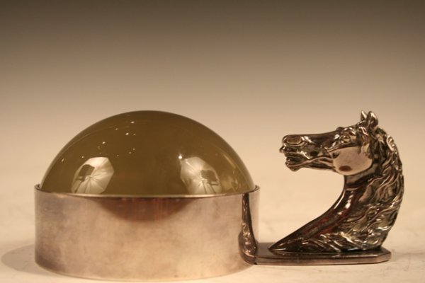 Hermes Magnifying Glass w/ Horse-Head Handle: Dome-like magnifying glass with a handle in the shape of a horse's head by Hermes, glass and silver, France; marked on bottom HERMES PARIS and MADE IN FRANCE. Dimensions: 2-1/4"H x 5-1/2"L x